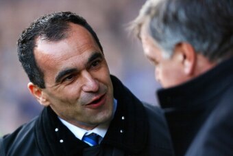 LIVERPOOL, ENGLAND - MARCH 01:  Roberto Martinez (L), manager of Everton talks to Sam Allardyce, manager of West Ham United during the Barclays Premier League match between Everton and West Ham United at Goodison Park on March 1, 2014 in Liverpool, Englan