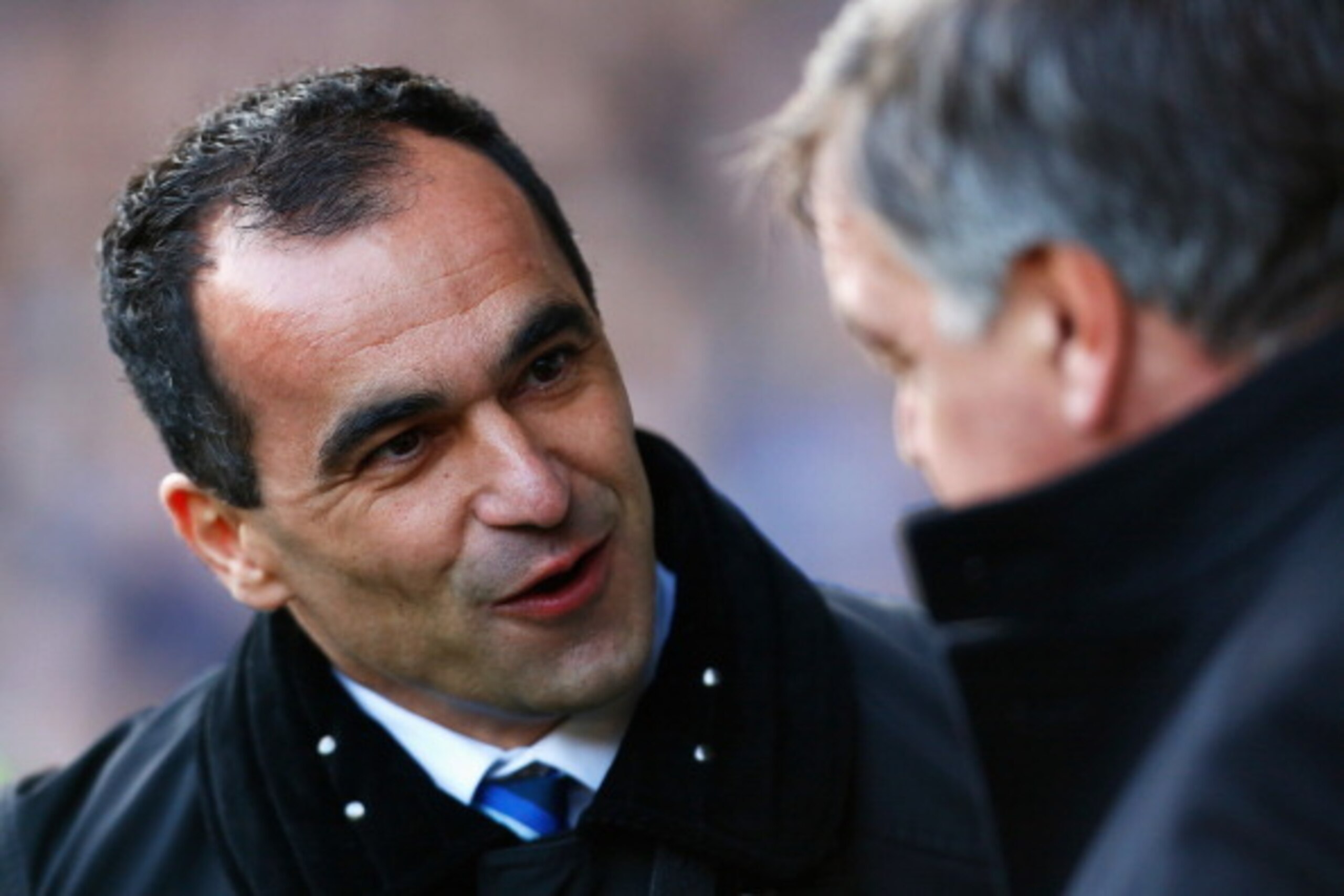 LIVERPOOL, ENGLAND - MARCH 01:  Roberto Martinez (L), manager of Everton talks to Sam Allardyce, manager of West Ham United during the Barclays Premier League match between Everton and West Ham United at Goodison Park on March 1, 2014 in Liverpool, Englan