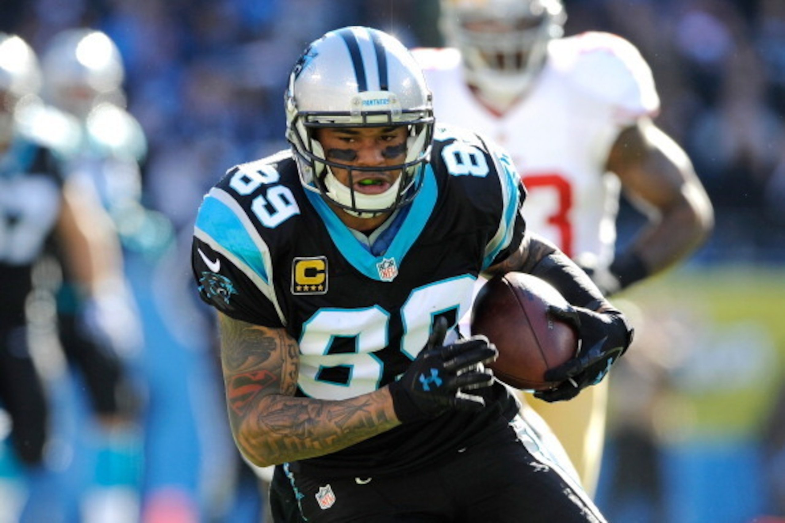 CHARLOTTE, NC - JANUARY 12: Steve Smith #89 of the Carolina Panthers runs with the ball after a catch in the first quarter against the San Francisco 49ers during the NFC Divisional Playoff Game at Bank of America Stadium on January 12, 2014 in Charlotte, 