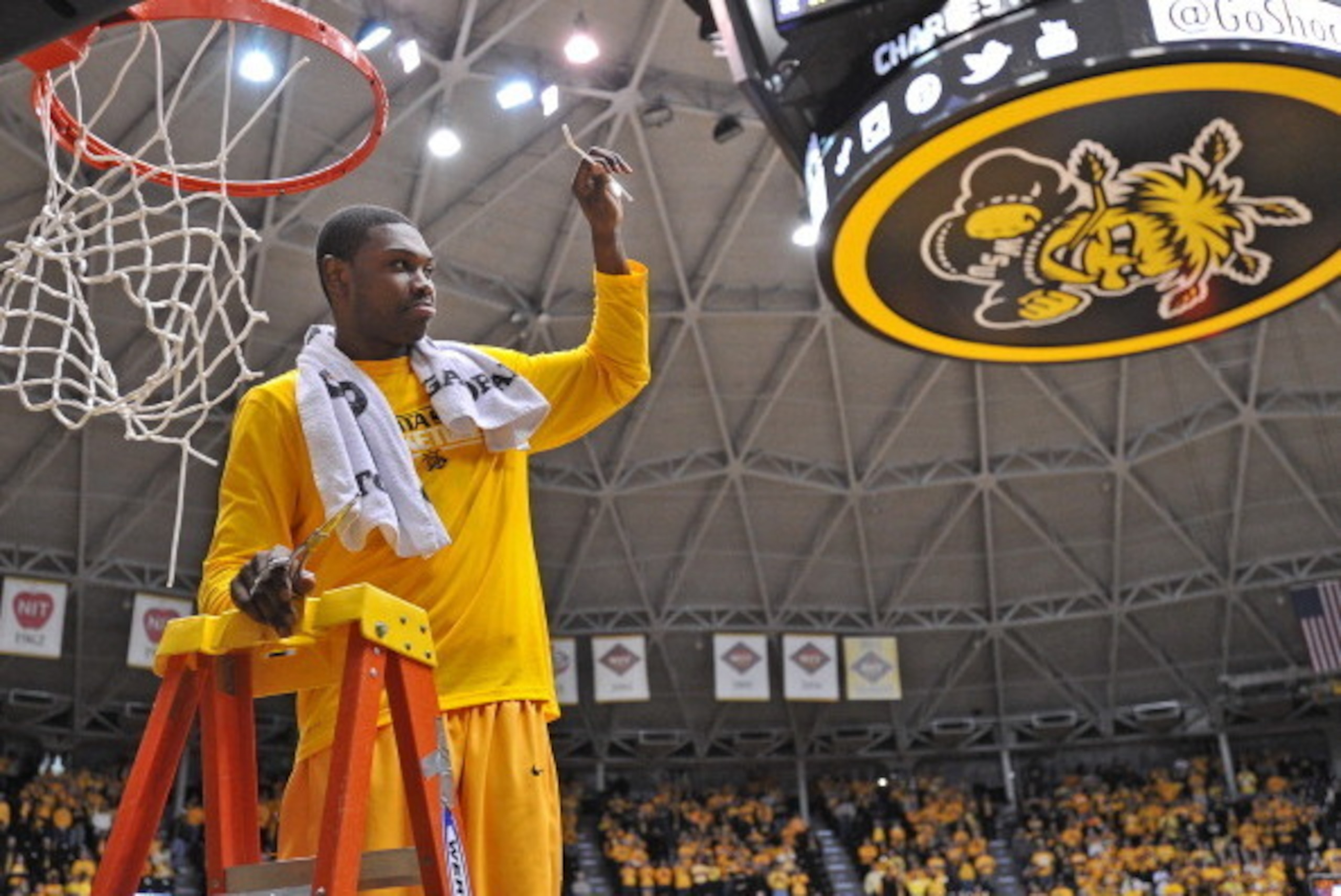 WICHITA, KS - FEBRUARY 22:  Forward Cleanthony Early #11 of the Wichita State Shockers cut down the net after beating the Drake Bulldogs to win the Missouri Valley Conference on February 22, 2014 at Charles Koch Arena in Wichita, Kansas.  Wichita State wo