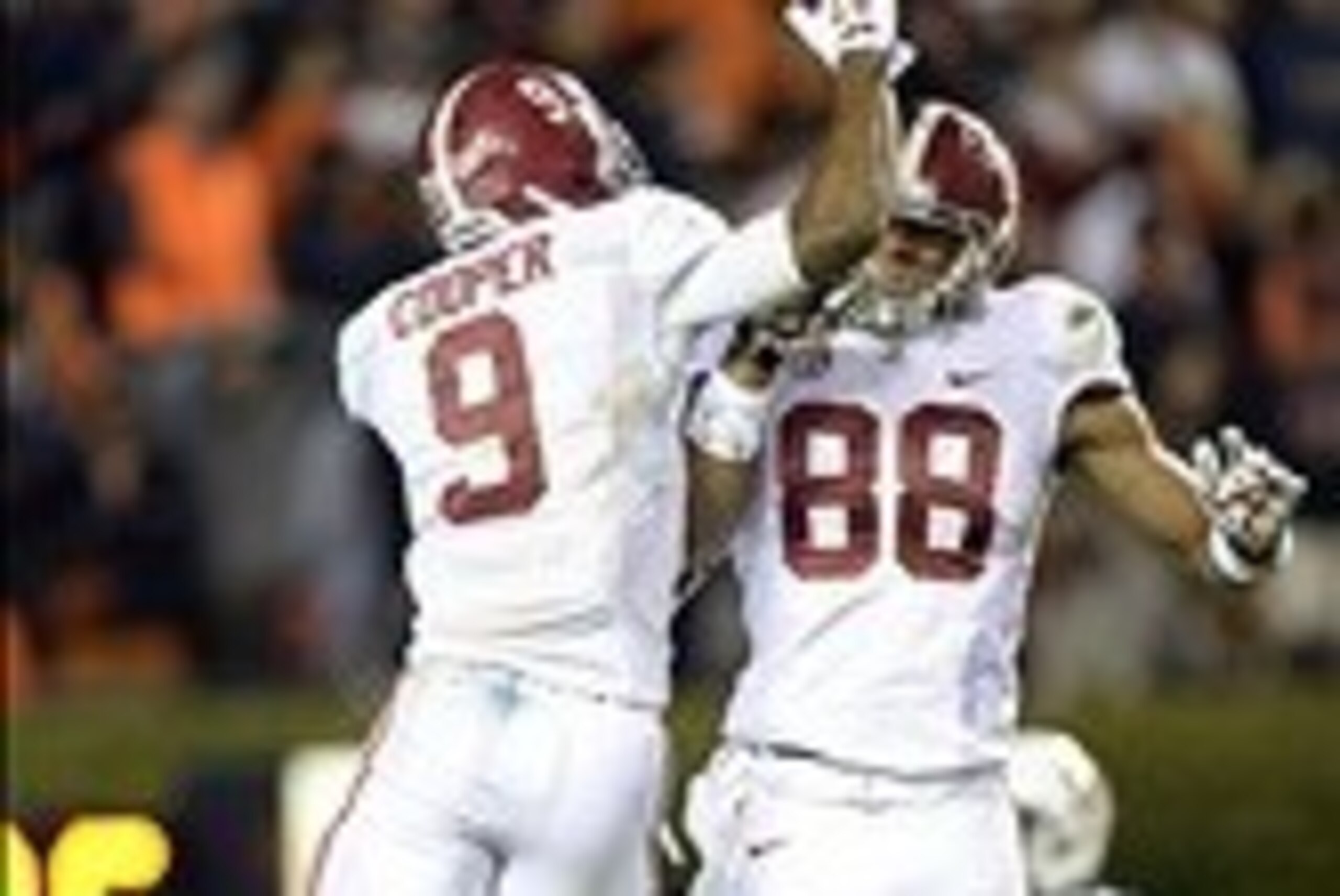 Nov 30, 2013; Auburn, AL, USA; Alabama Crimson Tide wide receiver Amari Cooper (9) celebrates his 99 yard touchdown with Alabama Crimson Tide tight end O.J. Howard (88) during the fourth quarter at Jordan Hare Stadium. Mandatory Credit: John David Mercer-