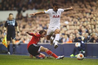 LONDON, ENGLAND - MARCH 13: Kyle Naughton of Tottenham Hotspur is tackled by Lazar Markovic of Benfica during the UEFA Europa League Round of 16 first leg match between Tottenham Hotspur FC and SL Benfica at White Hart Lane on March 13, 2014 in London, E LONDON, ENGLAND - MARCH 13: Kyle Naughton of Tottenham Hotspur is tackled by Lazar Markovic of Benfica during the UEFA Europa League Round of 16 first leg match between Tottenham Hotspur FC and SL Benfica at White Hart Lane on March 13, 2014 in London, E