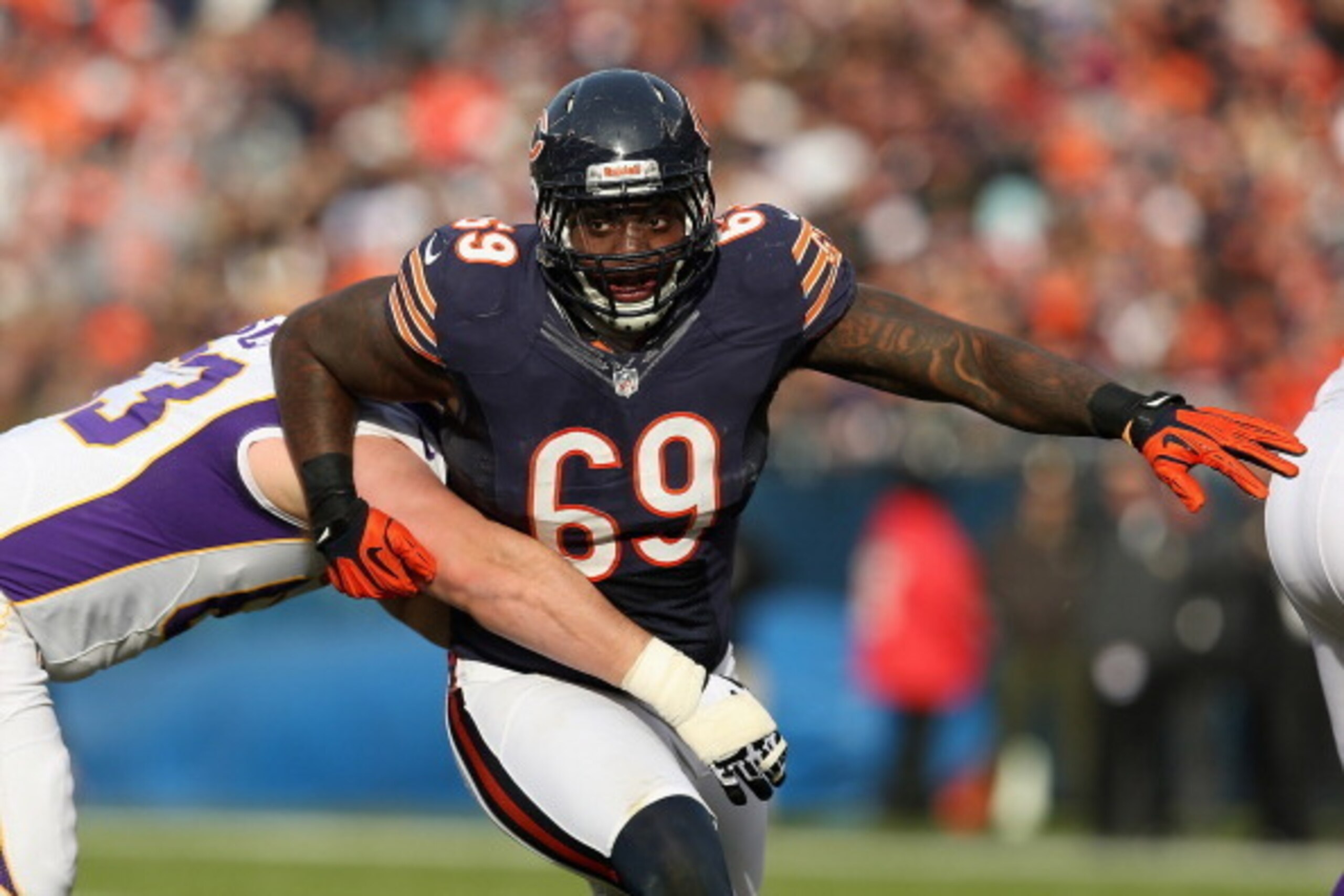 CHICAGO, IL - NOVEMBER 25: Henry Melton #69 of the Chicago Bears rushes against Brandon Fusco #63 of the Minnesota Vikings at Soldier Field on November 25, 2012 in Chicago, Illinois. The Bears defeated the Vikings 28-10.  (Photo by Jonathan Daniel/Getty I