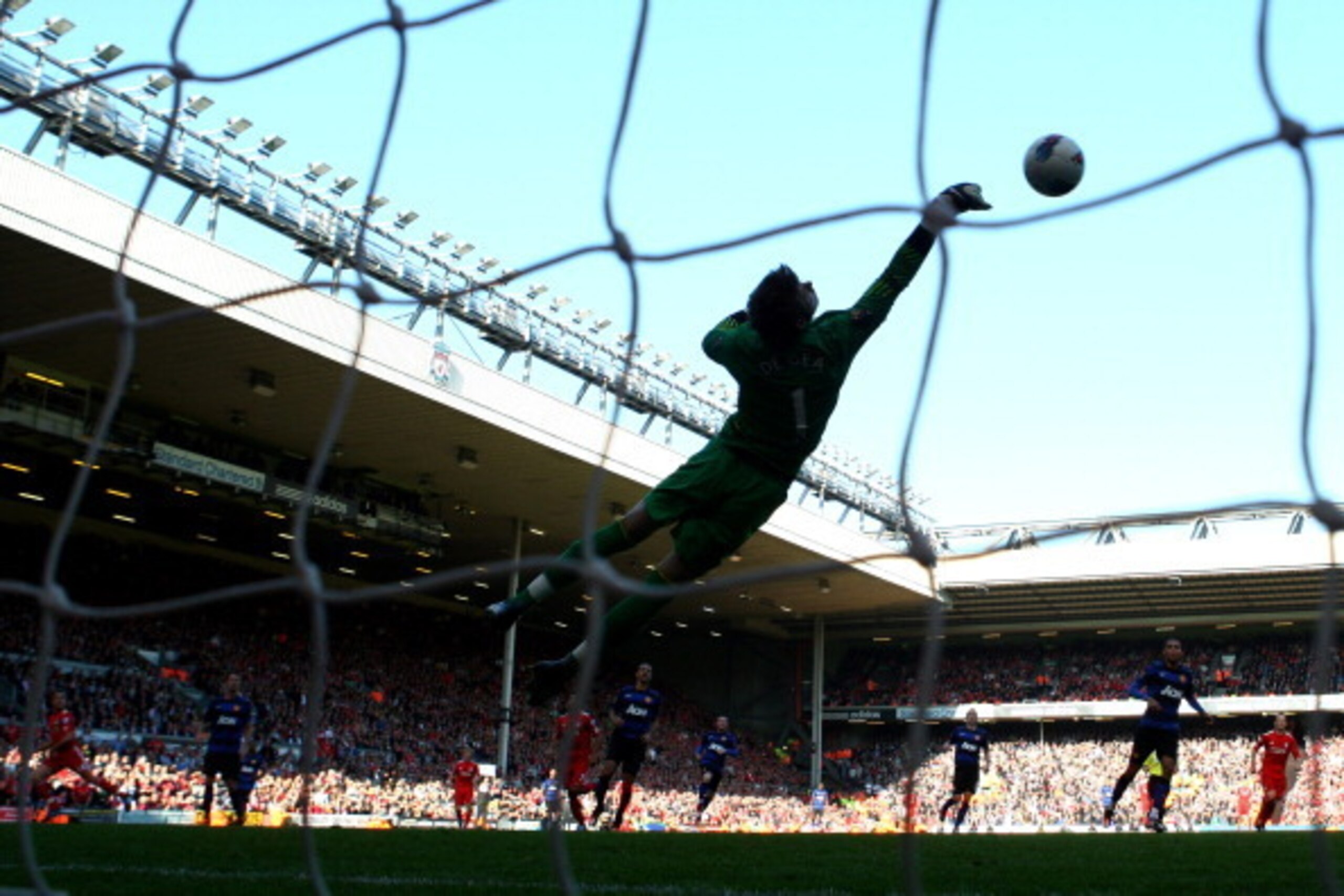 LIVERPOOL, ENGLAND - OCTOBER 15:  David de Gea of Manchester United saves the attempt on goal of Jordan Henderson of Liverpool during the Barclays Premier League match between Liverpool and Manchester United at Anfield on October 15, 2011 in Liverpool, En