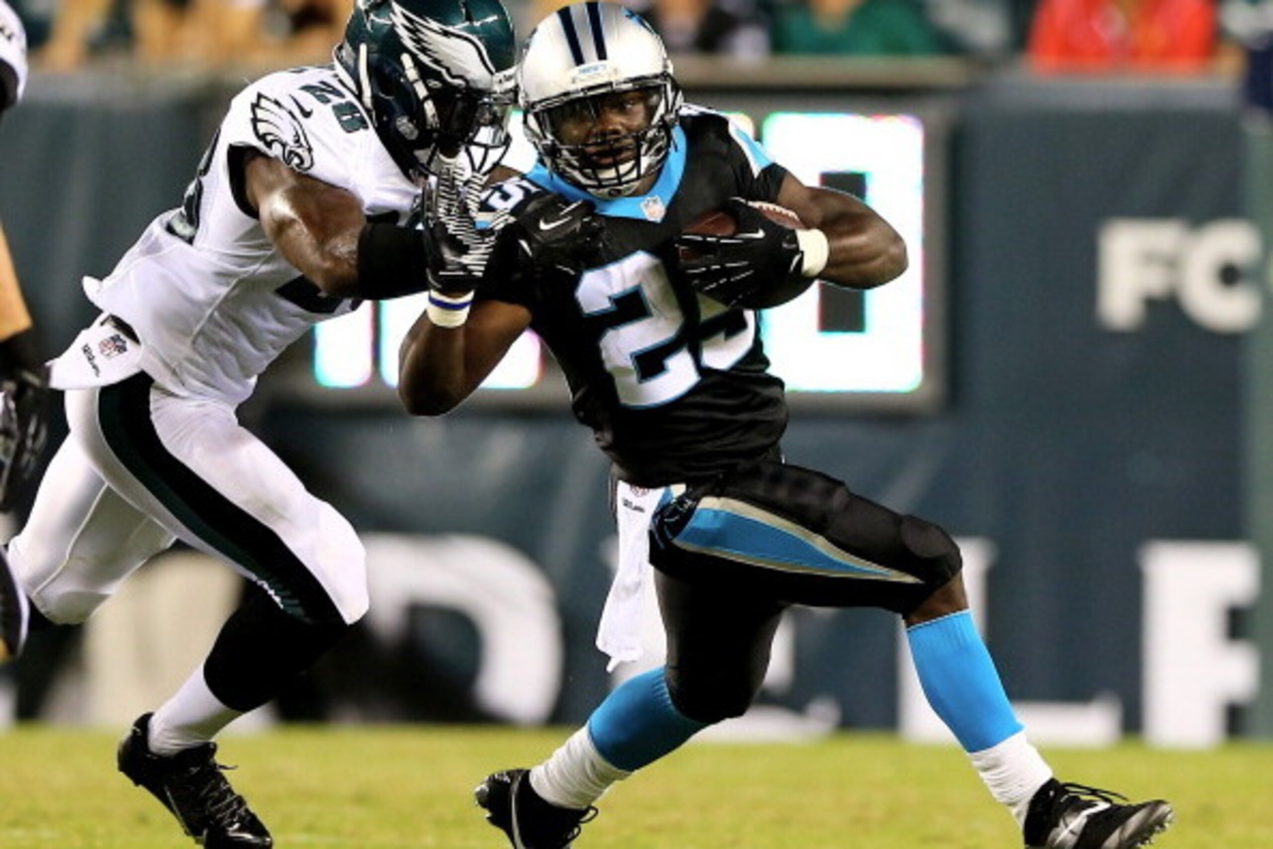 PHILADELPHIA, PA - AUGUST 15: Kenjon Barner #25 of the Carolina Panthers carries the ball as Earl Wolff #28 of the Philadelphia Eagles defends on August 15, 2013 at Lincoln Financial Field in Philadelphia, Pennslyvania. (Photo by Elsa/Getty Images) PHILADELPHIA, PA - AUGUST 15: Kenjon Barner #25 of the Carolina Panthers carries the ball as Earl Wolff #28 of the Philadelphia Eagles defends on August 15, 2013 at Lincoln Financial Field in Philadelphia, Pennslyvania. (Photo by Elsa/Getty Images)