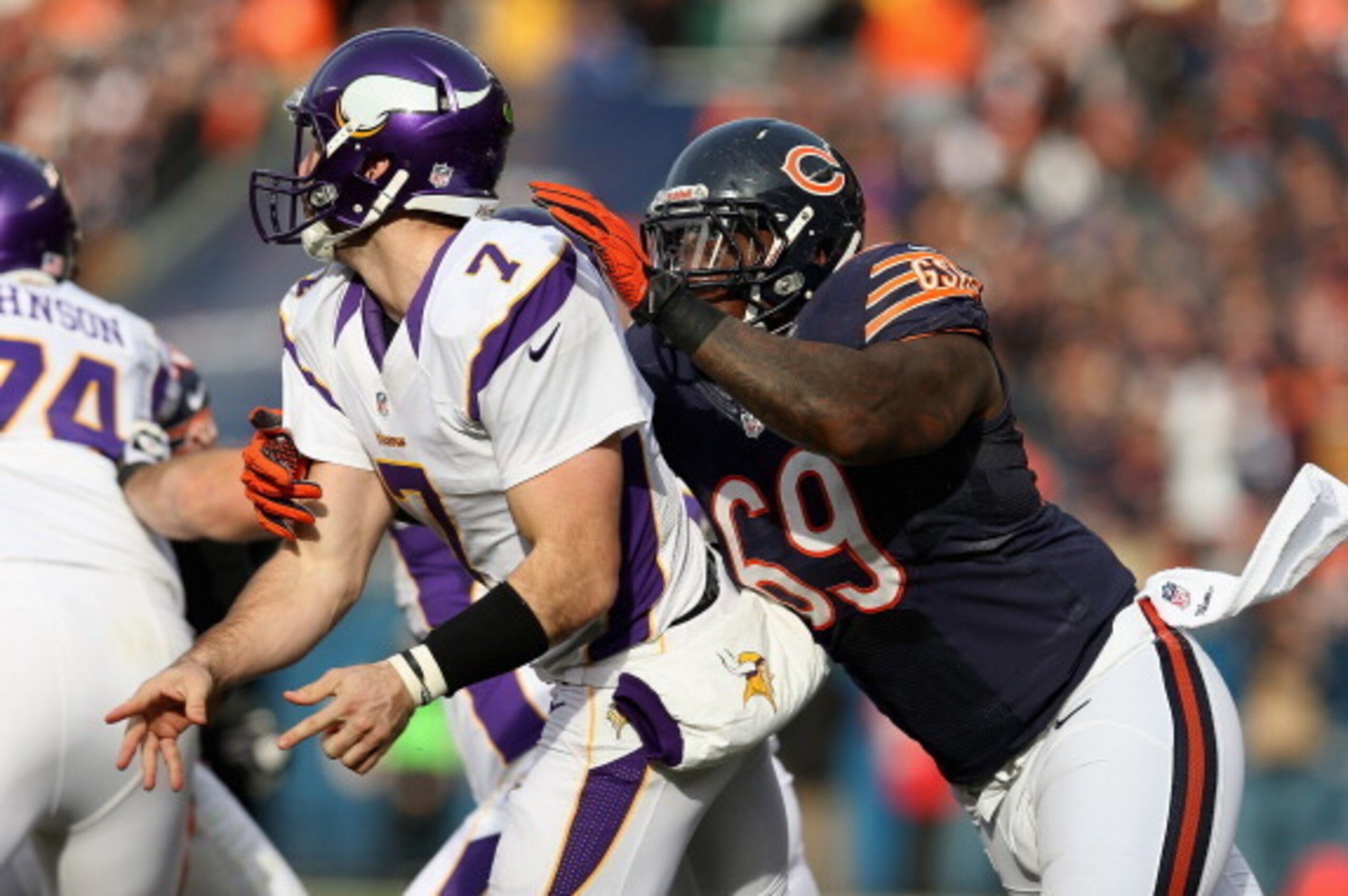 CHICAGO, IL - NOVEMBER 25: Henry Melton #69 of the Chicago Bears hits Christian Ponder #7 of the Minnesota Vikings at Soldier Field on November 25, 2012 in Chicago, Illinois. The Bears defeated the Vikings 28-10.  (Photo by Jonathan Daniel/Getty Images)