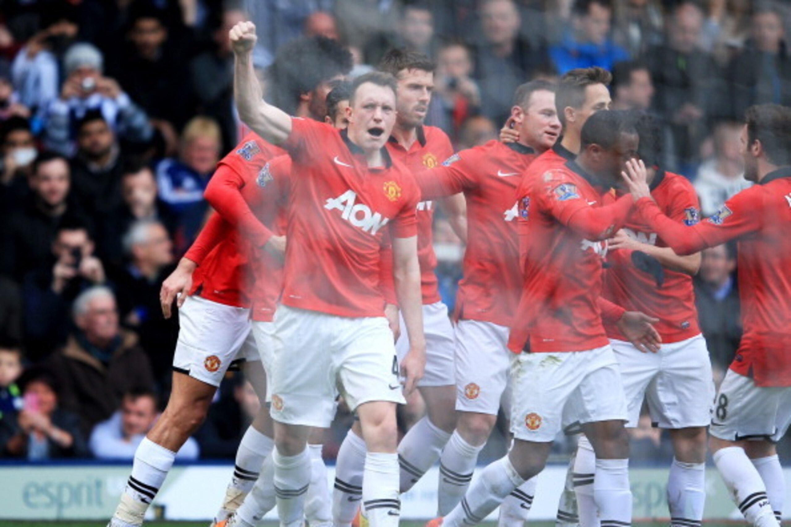 WEST BROMWICH, ENGLAND - MARCH 08:  Phil Jones of Manchester United (4) celebrates with team mates as he scores their first goal with a header during the Barclays Premier League match between West Bromwich Albion and Manchester United at The Hawthorns on 