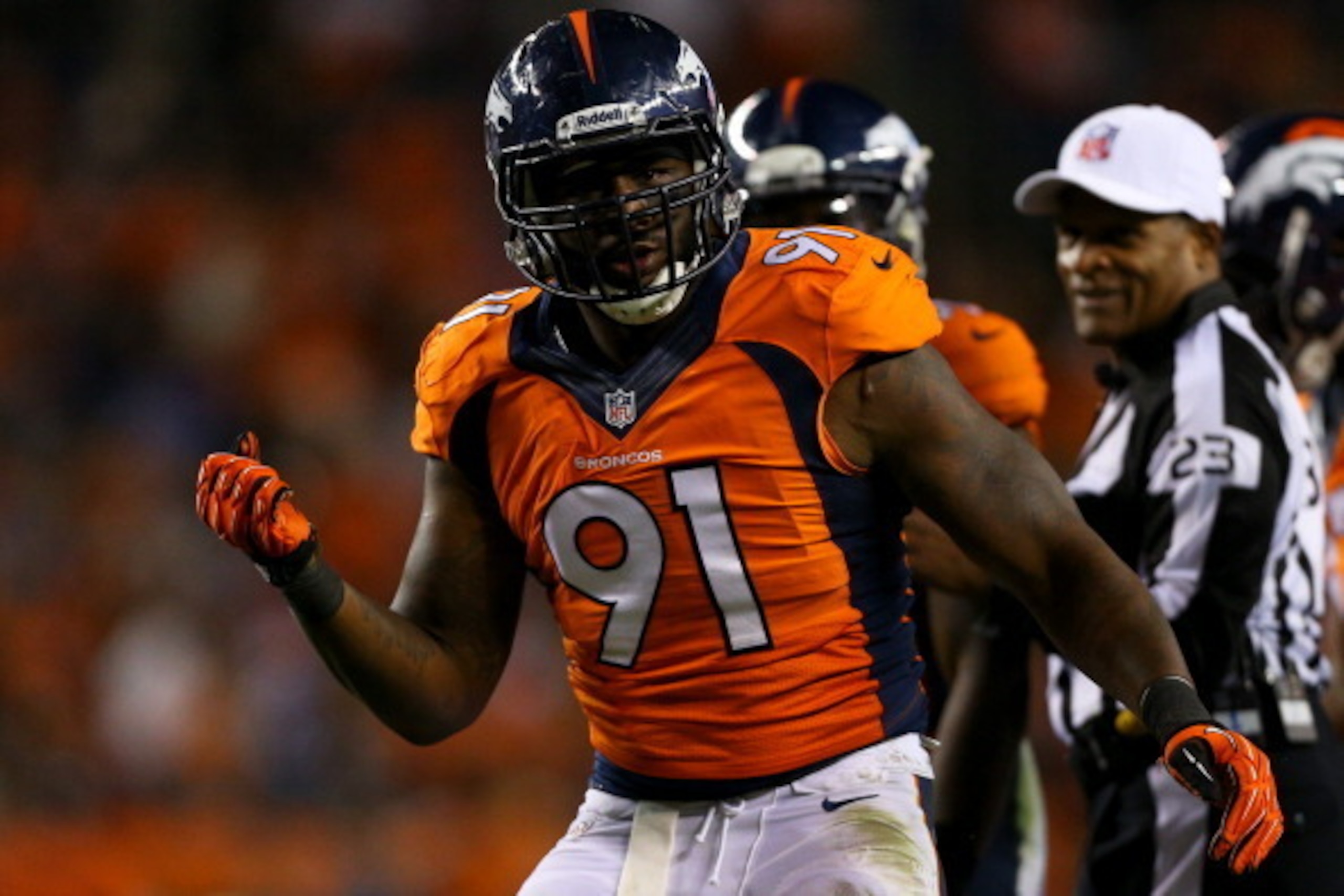 DENVER, CO - SEPTEMBER 23:  Defensive end Robert Ayers #91 of the Denver Broncos celebrates after recording a sack against the Oakland Raiders at Sports Authority Field Field at Mile High on September 23, 2013 in Denver, Colorado. The Broncos defeated the