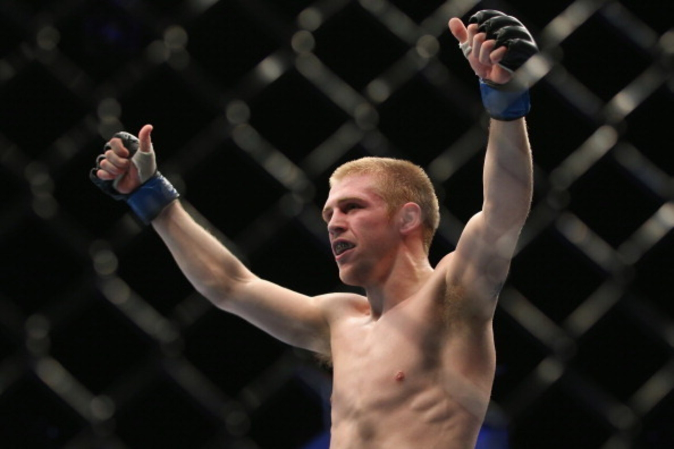 BRISBANE, AUSTRALIA - DECEMBER 07:  Justin Scoggins celebrates his victory against Richie Vaculik in their flyweight fight at Brisbane Entertainment Centre on December 7, 2013 in Brisbane, Australia.  (Photo by Chris Hyde/Getty Images)