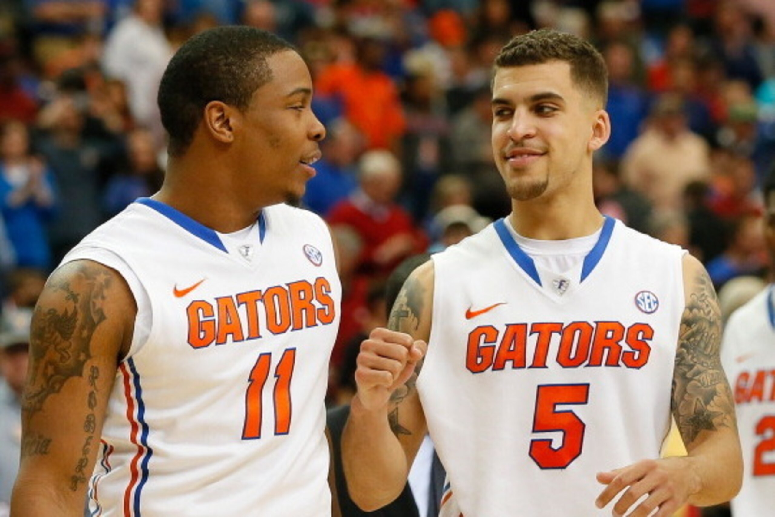ATLANTA, GA - MARCH 14: Scottie Wilbekin #5 of the Florida Gators reacts with Lexx Edwards #11 after their 72-49 win over the Missouri Tigers during the quarterfinals of the SEC Men's Basketball Tournament at Georgia Dome on March 14, 2014 in Atlanta, Ge ATLANTA, GA - MARCH 14: Scottie Wilbekin #5 of the Florida Gators reacts with Lexx Edwards #11 after their 72-49 win over the Missouri Tigers during the quarterfinals of the SEC Men's Basketball Tournament at Georgia Dome on March 14, 2014 in Atlanta, Ge