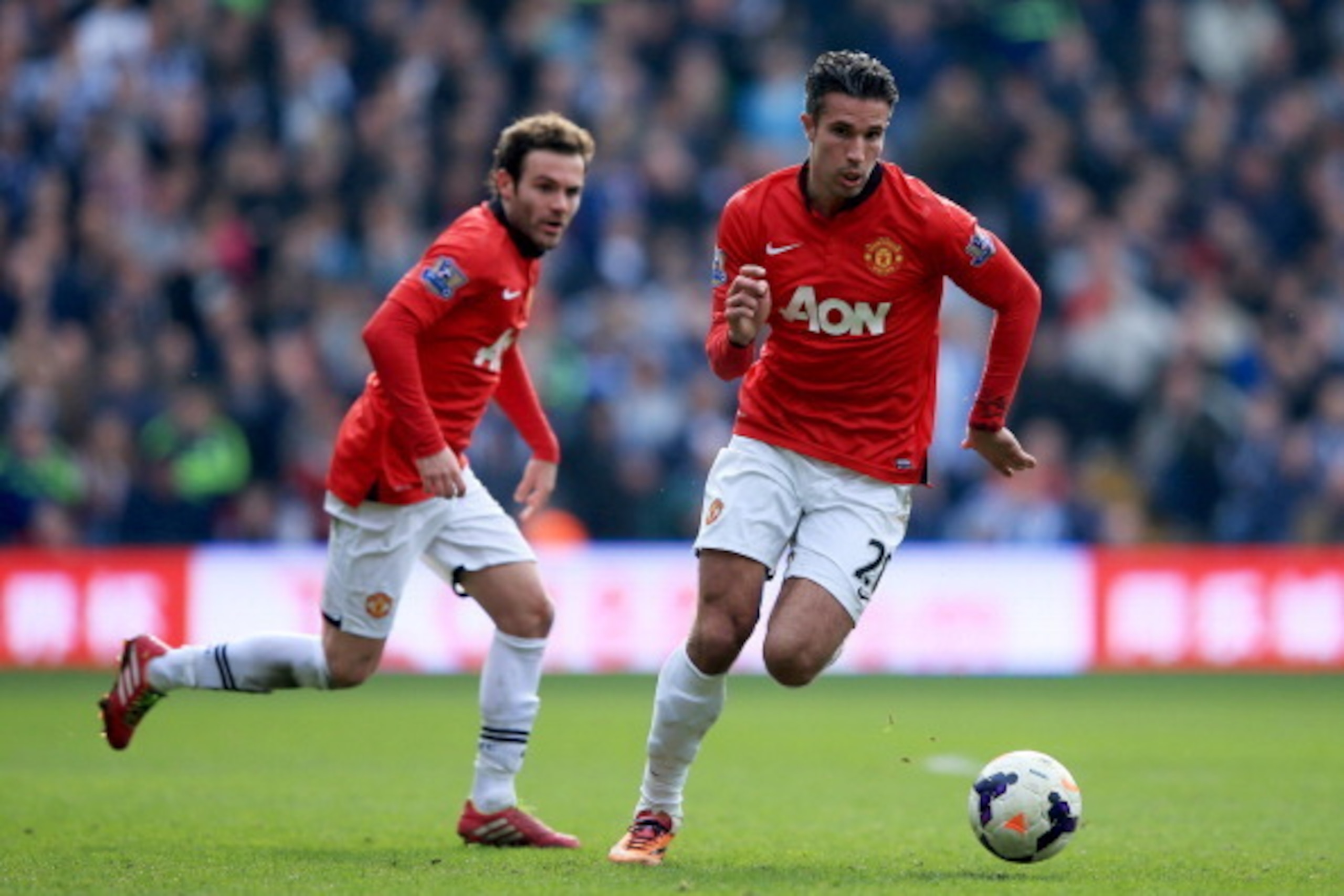 WEST BROMWICH, ENGLAND - MARCH 08:  Robin van Persie and Juan Mata of Manchester United in action during the Barclays Premier League match between West Bromwich Albion and Manchester United at The Hawthorns on March 8, 2014 in West Bromwich, England.  (Ph