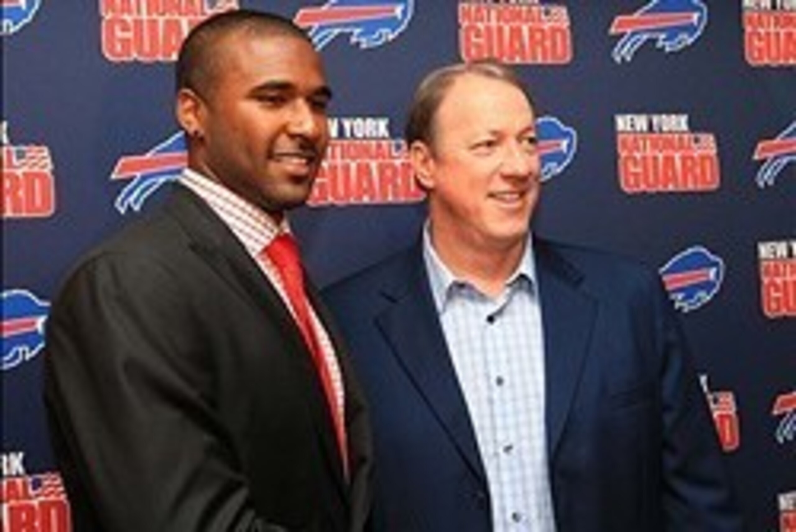 Apr 26, 2013; Orchard Park, NY, USA; Buffalo Bills first round draft pick quarterback E.J. Manuel and former Bills quarterback Jim Kelly at the press conference at Ralph Wilson Stadium.  Mandatory Credit: Kevin Hoffman-USA TODAY Sports