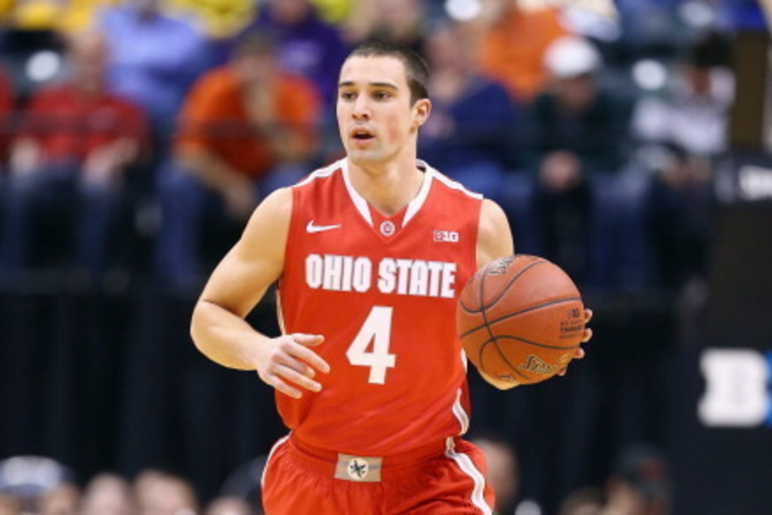 INDIANAPOLIS, IN - MARCH 14:  Aaron Craft #4 of the Ohio State Buckeyes dribbles the ball in the game against the  Nebraska Cornhuskers during the Quarterfinals of the Big Ten Basketball Tournament at Bankers Life Fieldhouse on March 14, 2014 in Indianapo