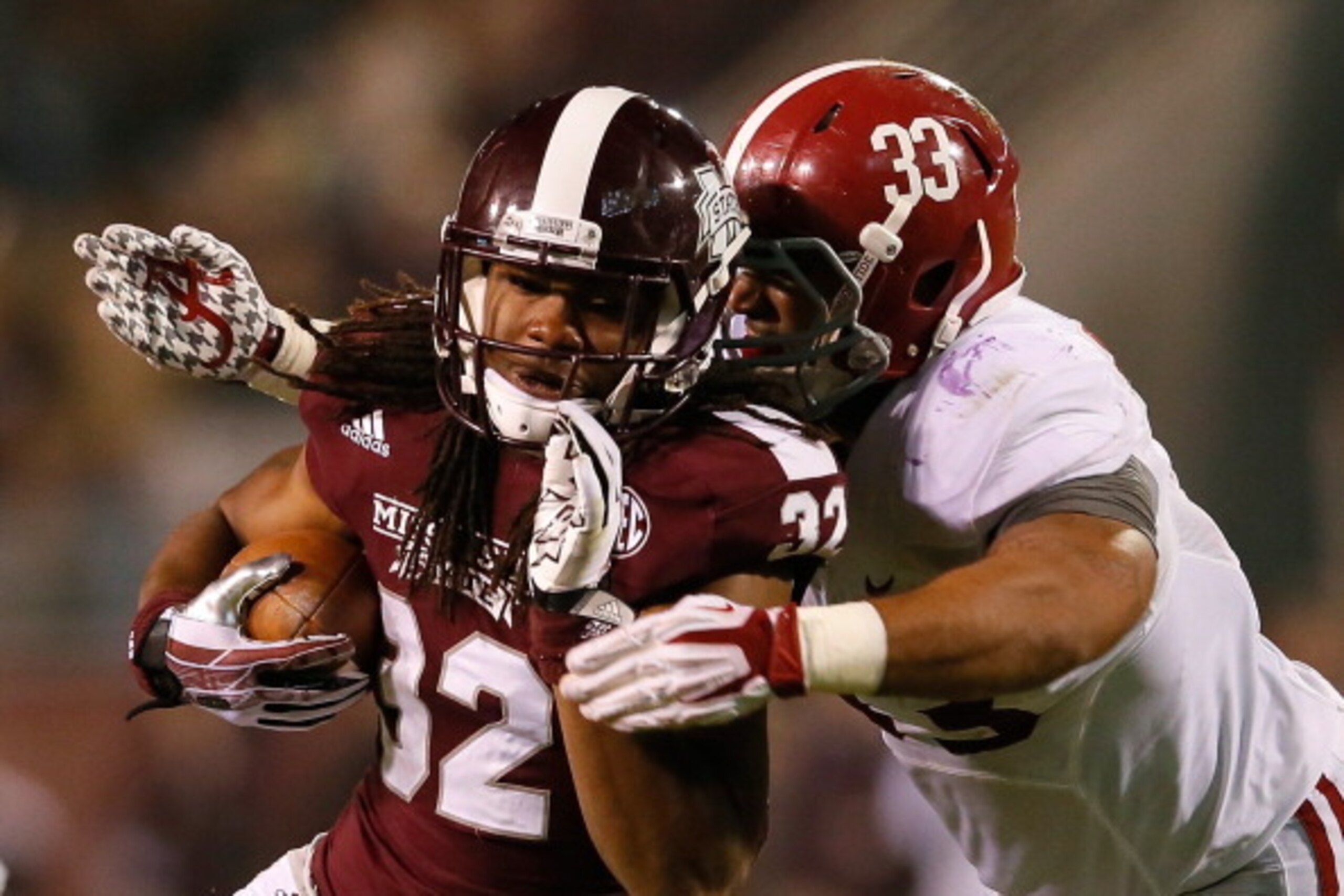 STARKVILLE, MS - NOVEMBER 16: Trey DePriest #33 of the Alabama Crimson Tide tackles Ashton Shumpert #32 of the Mississippi State Bulldogs at Davis Wade Stadium on November 16, 2013 in Starkville, Mississippi. (Photo by Kevin C. Cox/Getty Images) STARKVILLE, MS - NOVEMBER 16: Trey DePriest #33 of the Alabama Crimson Tide tackles Ashton Shumpert #32 of the Mississippi State Bulldogs at Davis Wade Stadium on November 16, 2013 in Starkville, Mississippi. (Photo by Kevin C. Cox/Getty Images)
