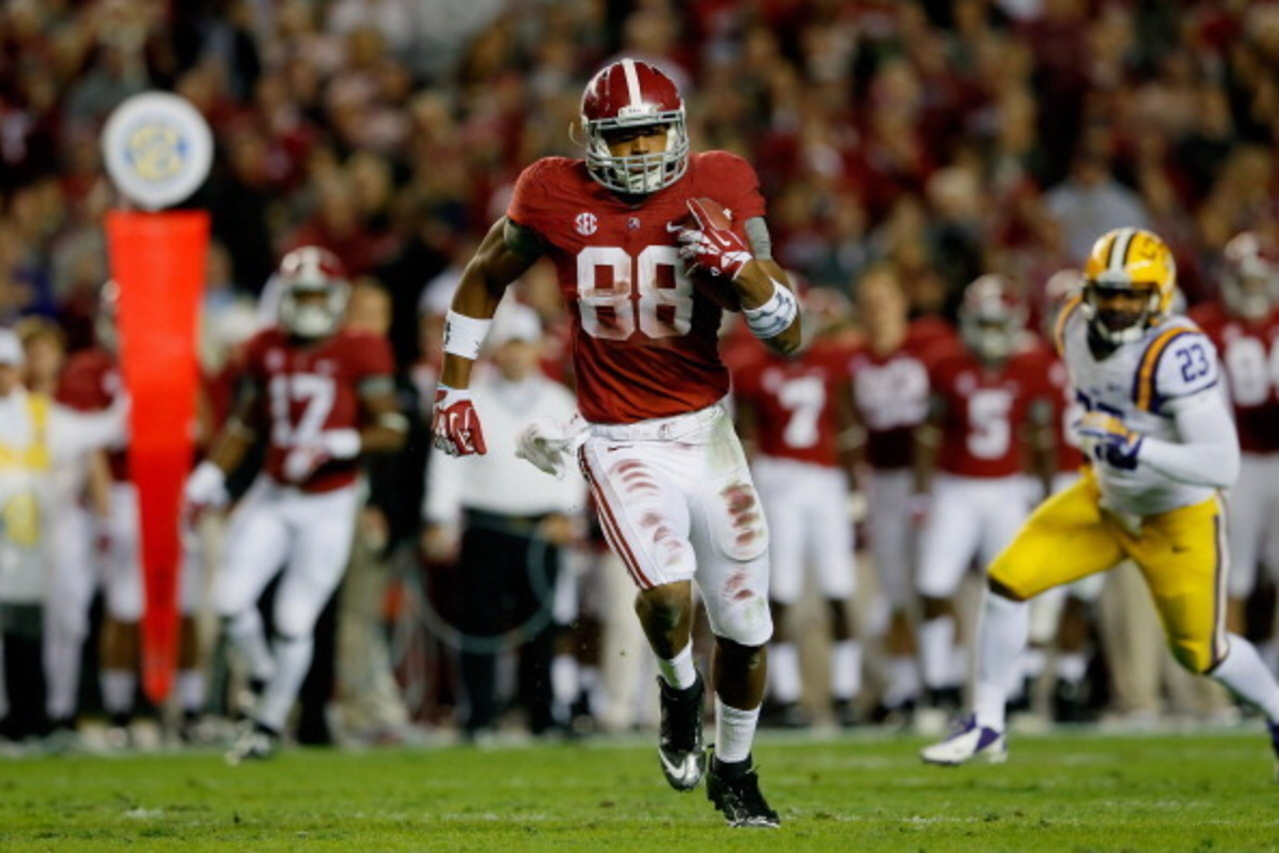 TUSCALOOSA, AL - NOVEMBER 09: O.J. Howard #88 of the Alabama Crimson Tide runs 52 yards for a touchdown in the second quarter against the LSU Tigers at Bryant-Denny Stadium on November 9, 2013 in Tuscaloosa, Alabama. (Photo by Kevin C. Cox/Getty Images) TUSCALOOSA, AL - NOVEMBER 09: O.J. Howard #88 of the Alabama Crimson Tide runs 52 yards for a touchdown in the second quarter against the LSU Tigers at Bryant-Denny Stadium on November 9, 2013 in Tuscaloosa, Alabama. (Photo by Kevin C. Cox/Getty Images)