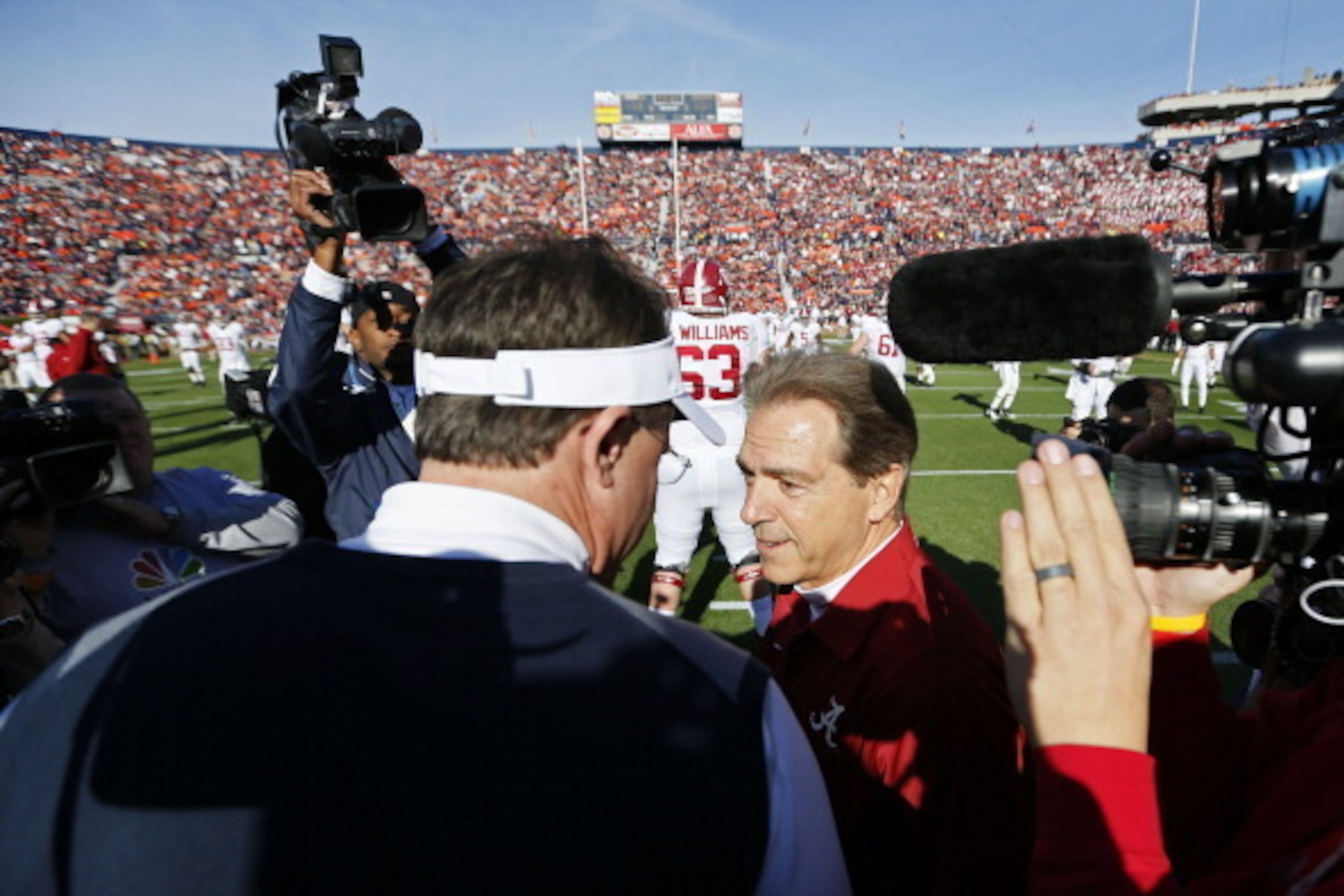 AUBURN, AL - NOVEMBER 30: Head coach Gus Malzahn of the Auburn Tigers and head coach Nick Saban of the Alabama Crimson Tide shake hands prior to their game at Jordan-Hare Stadium on November 30, 2013 in Auburn, Alabama. (Photo by Kevin C. Cox/Getty Imag AUBURN, AL - NOVEMBER 30: Head coach Gus Malzahn of the Auburn Tigers and head coach Nick Saban of the Alabama Crimson Tide shake hands prior to their game at Jordan-Hare Stadium on November 30, 2013 in Auburn, Alabama. (Photo by Kevin C. Cox/Getty Imag
