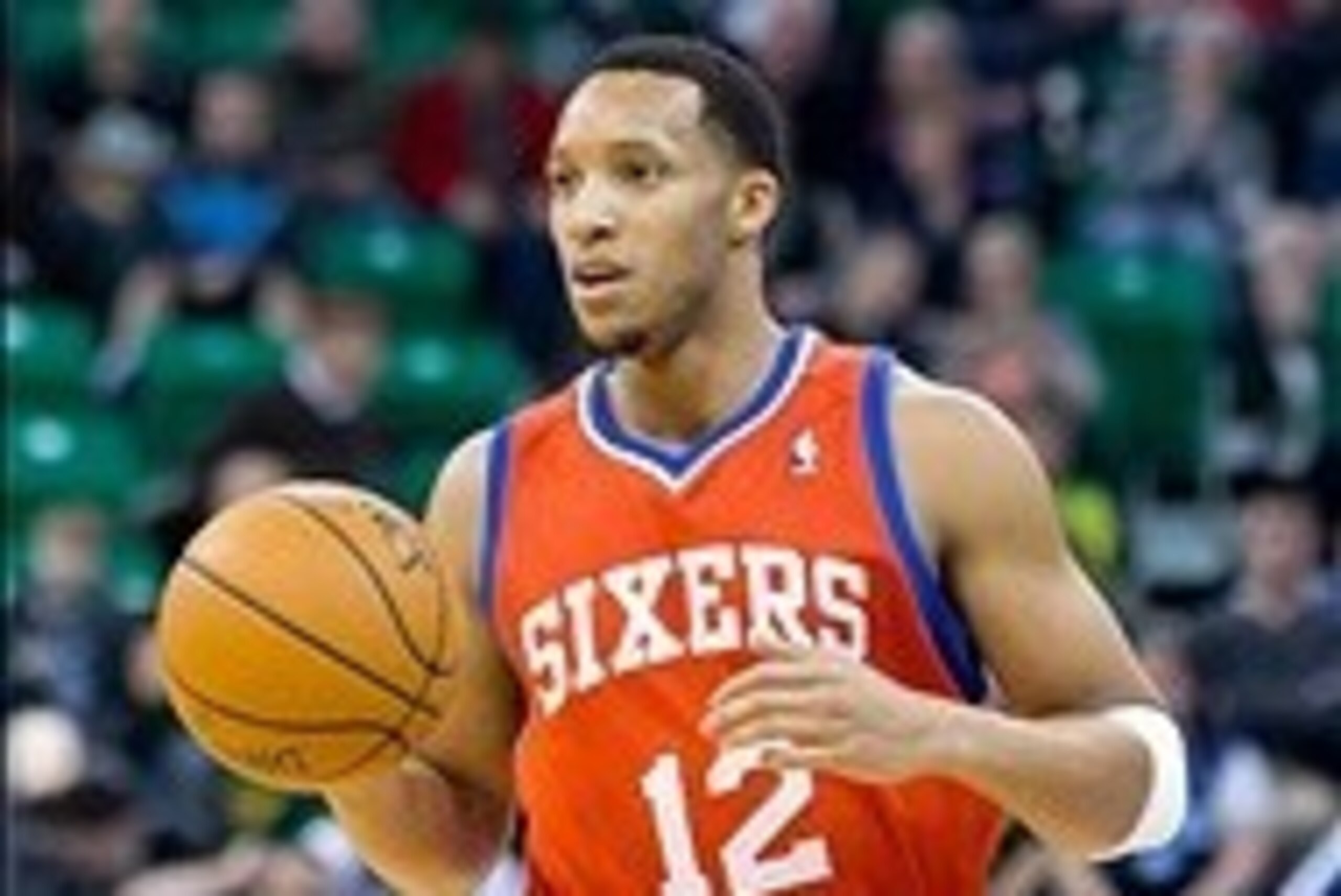 Feb 12, 2014; Salt Lake City, UT, USA; Philadelphia 76ers small forward Evan Turner (12) dribbles up the court during the first quarter against the Utah Jazz at EnergySolutions Arena. Mandatory Credit: Russ Isabella-USA TODAY Sports