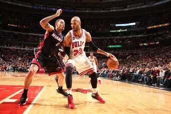 CHICAGO, IL - MARCH 9: Taj Gibson #22 of the Chicago Bulls handles the ball against the Miami Heat during a game at the United Center in Chicago. NOTE TO USER: User expressly acknowledges and agrees that, by downloading and or using this photograph, User 