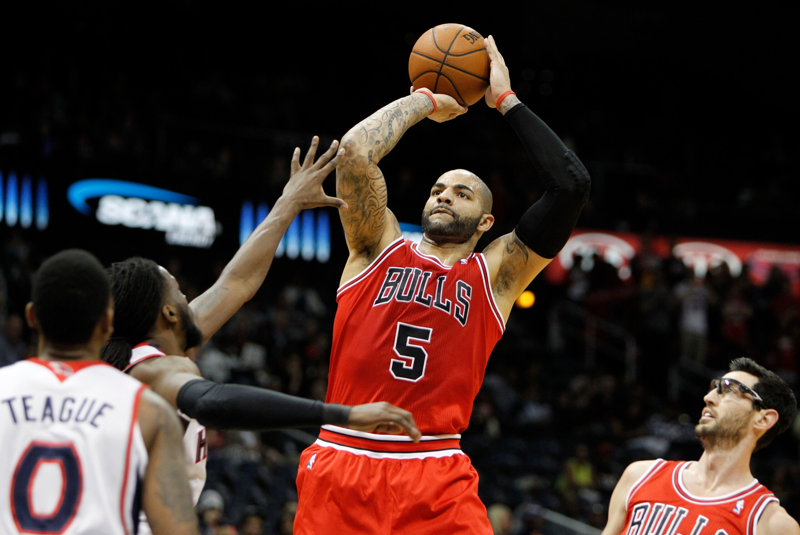 Feb 25, 2014; Atlanta, GA, USA; Chicago Bulls power forward Carlos Boozer (5) shoots the ball against the Atlanta Hawks in the first quarter at Philips Arena. Mandatory Credit: Brett Davis-USA TODAY Sports