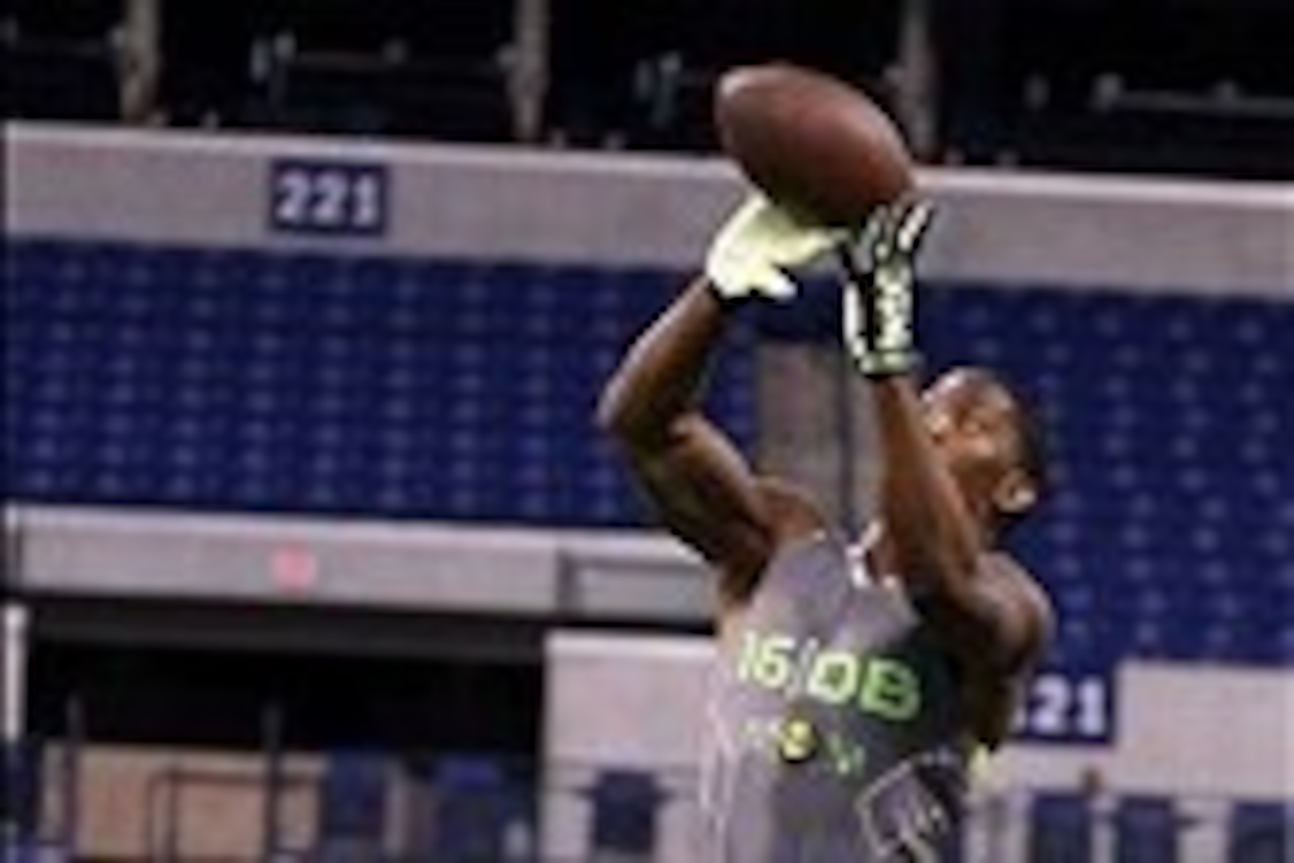 Feb 25, 2014; Indianapolis, IN, USA; Michigan State Spartans defensive back Darqueze Dennard jumps in the air to make a catch during the 2014 NFL Combine at Lucas Oil Stadium. Mandatory Credit: Brian Spurlock-USA TODAY Sports