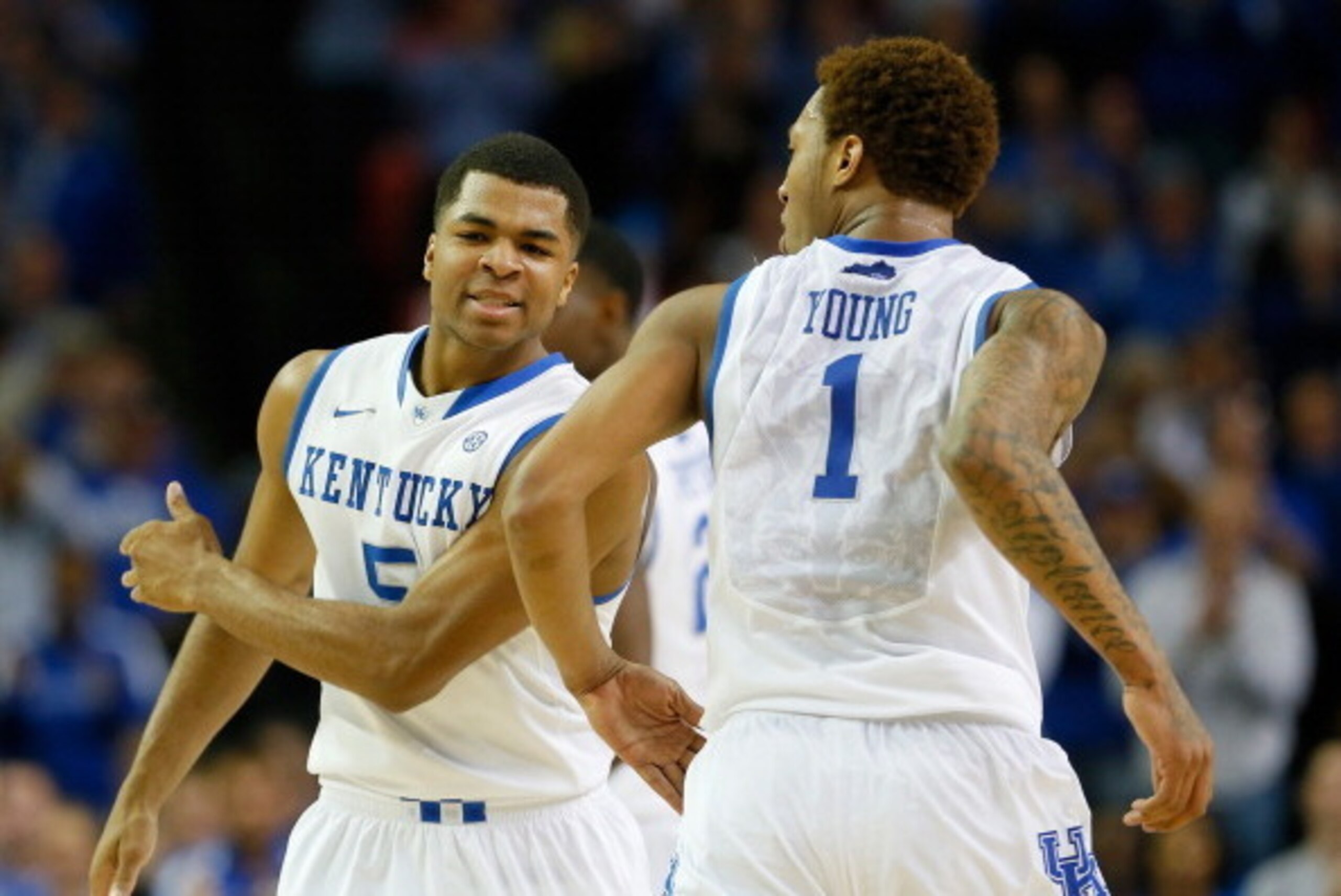 ATLANTA, GA - MARCH 14:  James Young #1 of the Kentucky Wildcats celebrates a dunk against the LSU Tigers with Andrew Harrison #5 during the quarterfinals of the SEC Men's Basketball Tournament at Georgia Dome on March 14, 2014 in Atlanta, Georgia.  (Phot