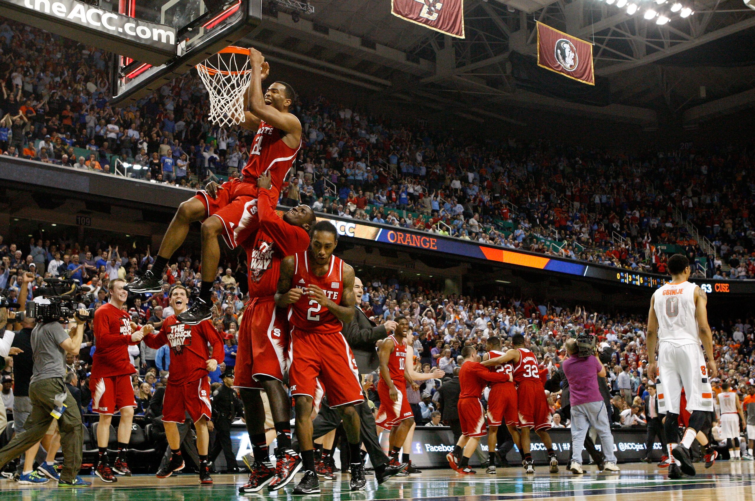 GREENSBORO, NC - MARCH 14:  T.J. Warren #24 of the North Carolina State Wolfpack celebrates after defeating the Syracuse Orange 66-63 during the quarterfinals of the 2014 Men's ACC Basketball Tournament at Greensboro Coliseum on March 14, 2014 in Greensbo
