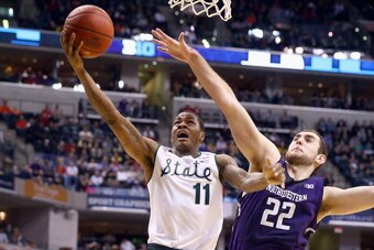INDIANAPOLIS, IN - MARCH 14:  Keith Appling #11 of the Michigan State Spartans shoots the ball in the game against the Northwestern Wildcats during the Quarterfinals of the Big Ten Basketball Tournament at Bankers Life Fieldhouse on March 14, 2014 in Indi