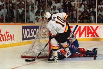 7 JUN 1994: RANGERS GOALTENDER MIKE RICHTER STONES CANUCK''S PAVEL BURE DURING A PENALTY SHOT TONIGHT DURING THE SECOND PERIOD OF GAME FOUR OF THE STANLEY CUP FINALS AT THE PACIFIC COLISEUM IN VANCOUVER, BRITISH COLUMBIA.  Mandatory Credit: Mike Powell/AL