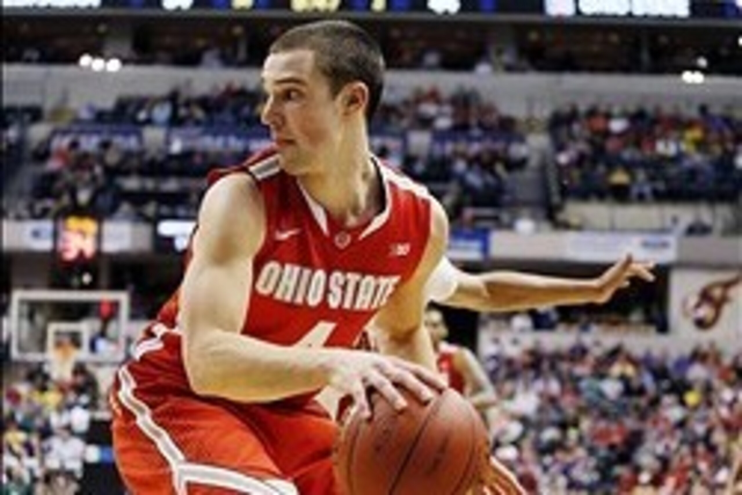 Mar 14, 2014; Indianapolis, IN, USA; Ohio State Buckeyes guard Aaron Craft (4) looks to make a pass on the baseline against the Nebraska Cornhuskers in the quarterfinals of the Big Ten college basketball tournament at Bankers Life Fieldhouse. Ohio State d