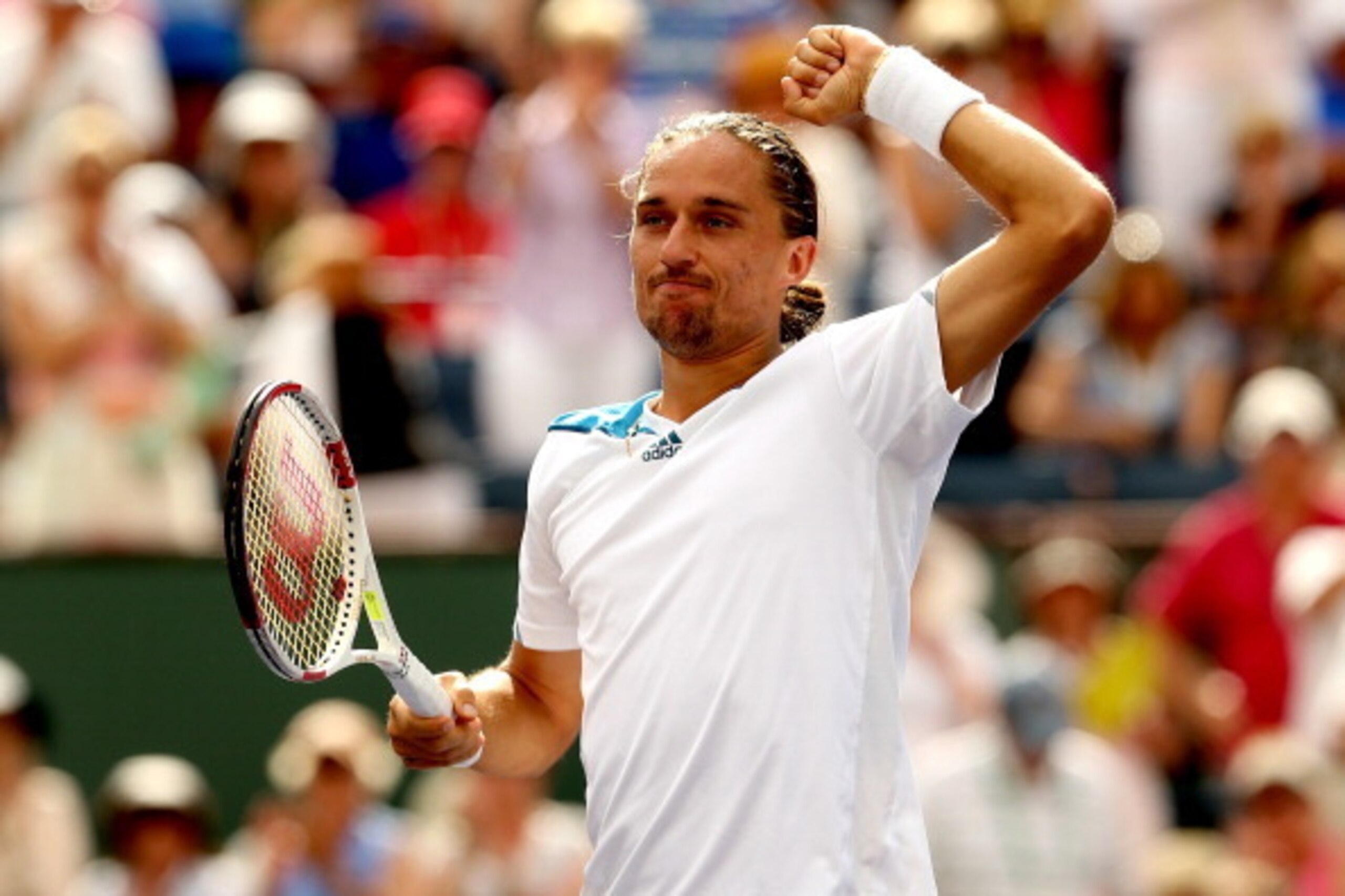 INDIAN WELLS, CA - MARCH 13:  Alexandr Dolgopolov of Ukraine celebrates his win over Milos Roanic of Canada during the BNP Parabas Open at the Indian Wells Tennis Garden on March 13, 2014 in Indian Wells, California.  (Photo by Matthew Stockman/Getty Imag