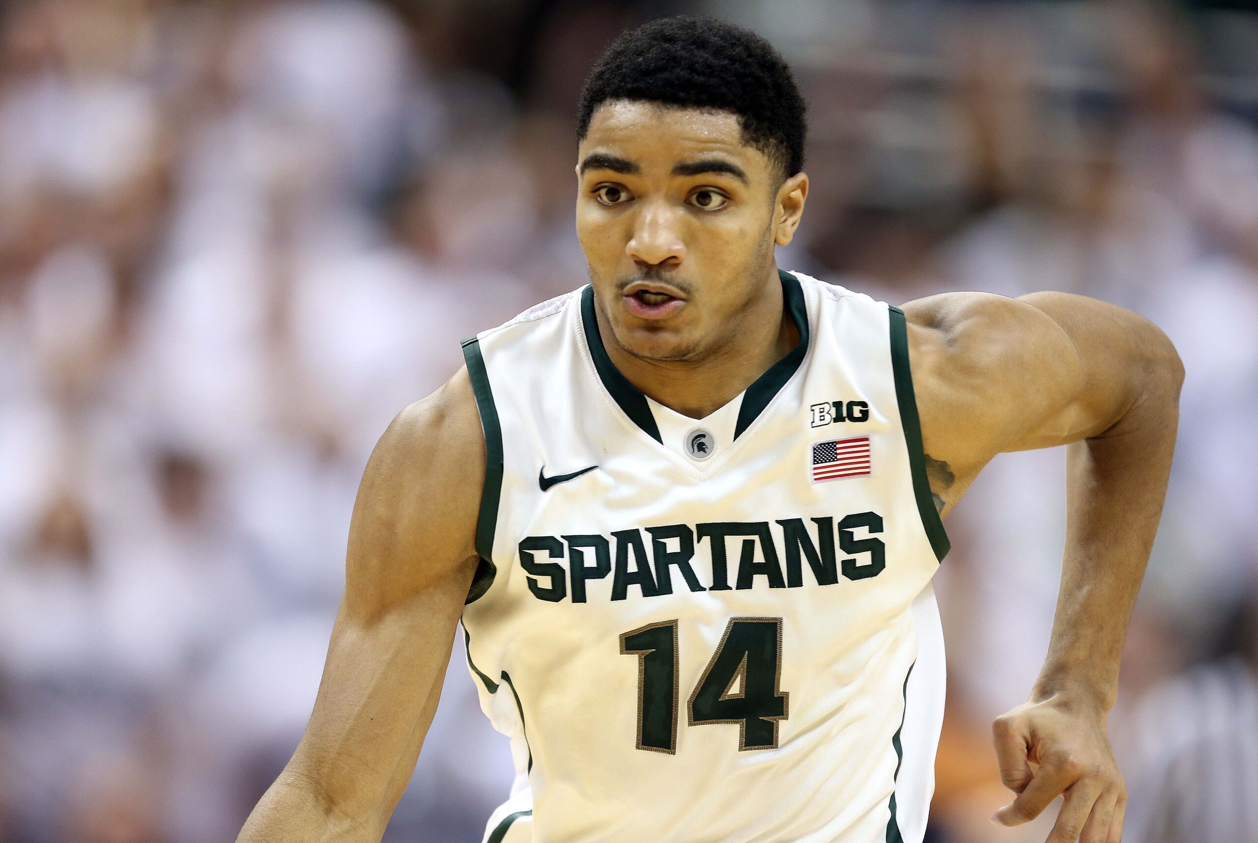 Mar 1, 2014; East Lansing, MI, USA; Michigan State Spartans guard Gary Harris (14) brings the ball up court against the Illinois Fighting Illini during the 2nd half of a game at Jack Breslin Student Events Center. Illinois won 53-46. Mandatory Credit: Mik
