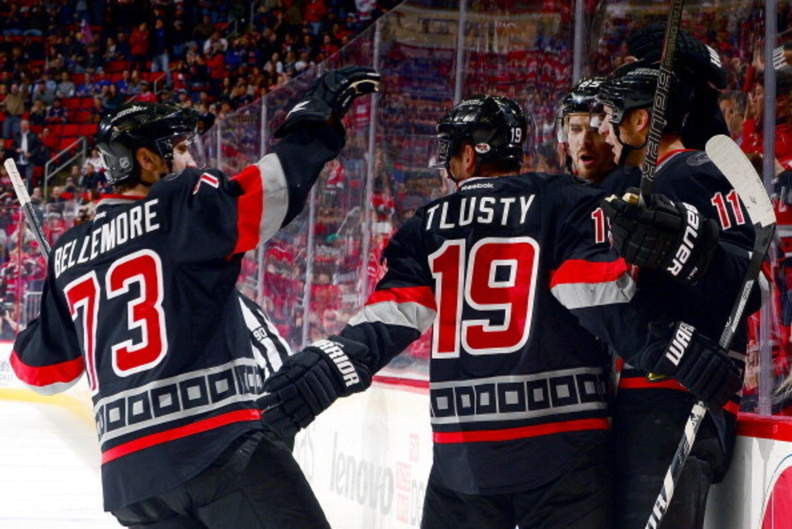 RALEIGH, NC - MARCH 7:  Brett Bellemore #73, Jiri Tlusty #19 and Ron Hainsey #65 of the Carolina Hurricanes celebrate a goal scored by Jordan Staal #11 against the New York Rangers during the first period of an NHL game on March 7, 2014 at PNC Arena in Ra