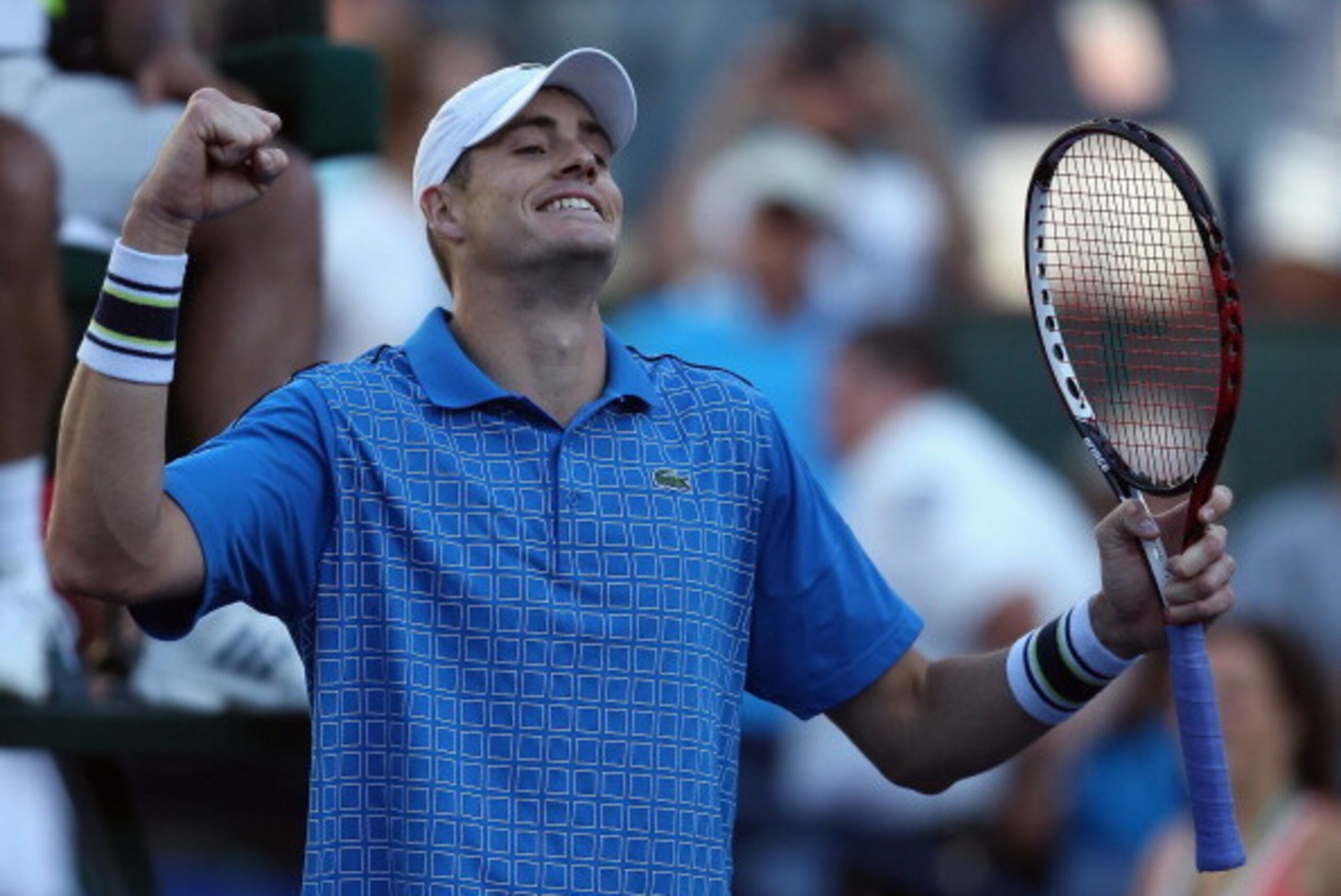 INDIAN WELLS, CA - MARCH 14:  John Isner celebrates following his victory over Ernests Gulbis of Latvia during the BNP Paribas Open at Indian Wells Tennis Garden on March 14, 2014 in Indian Wells, California.  (Photo by Jeff Gross/Getty Images)