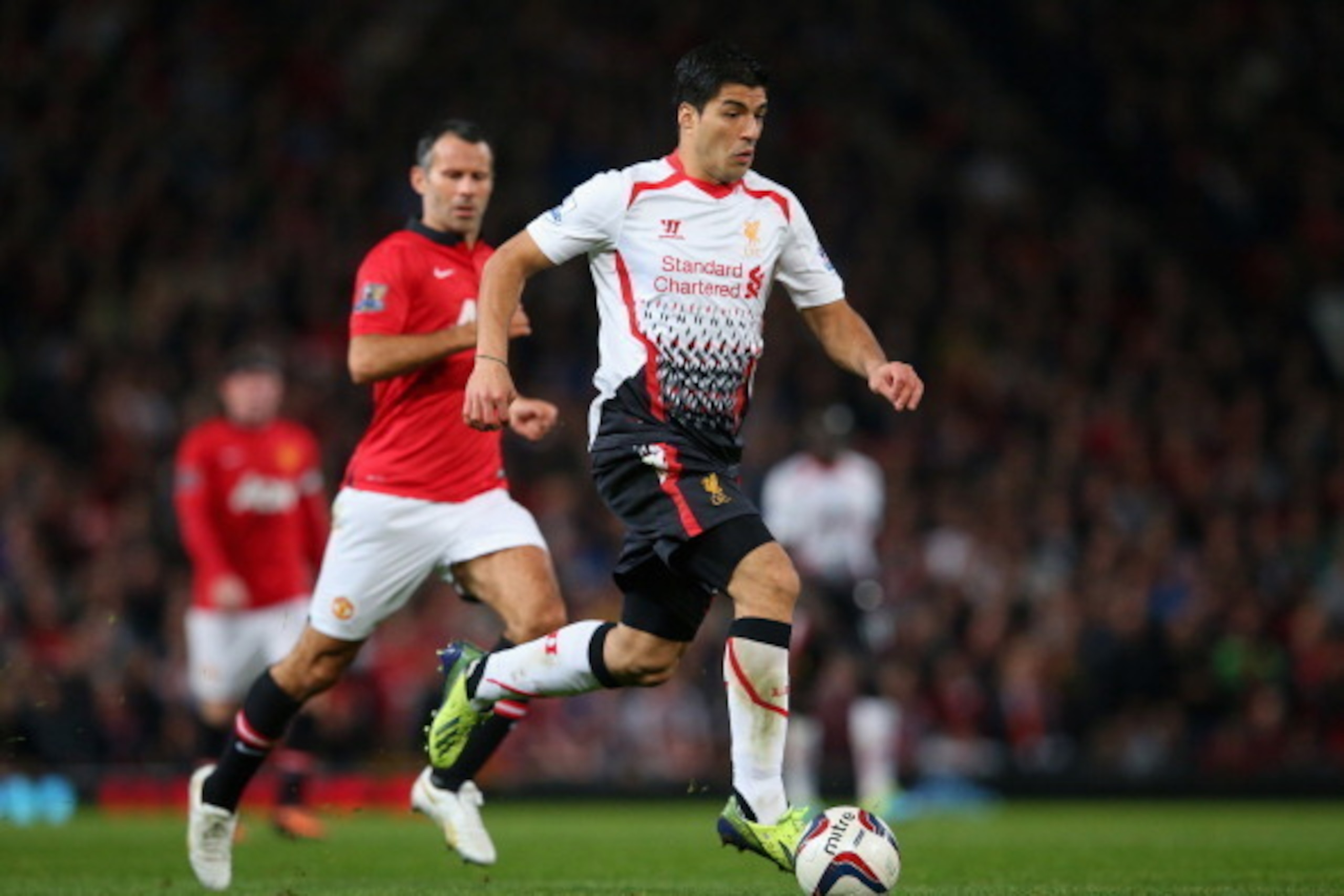MANCHESTER, ENGLAND - SEPTEMBER 25:  Luis Suarez of Liverpool in action during the Capital One Cup Third Round match betwen Manchester United and Liverpool at Old Trafford on September 25, 2013 in Manchester, England.  (Photo by Julian Finney/Getty Images