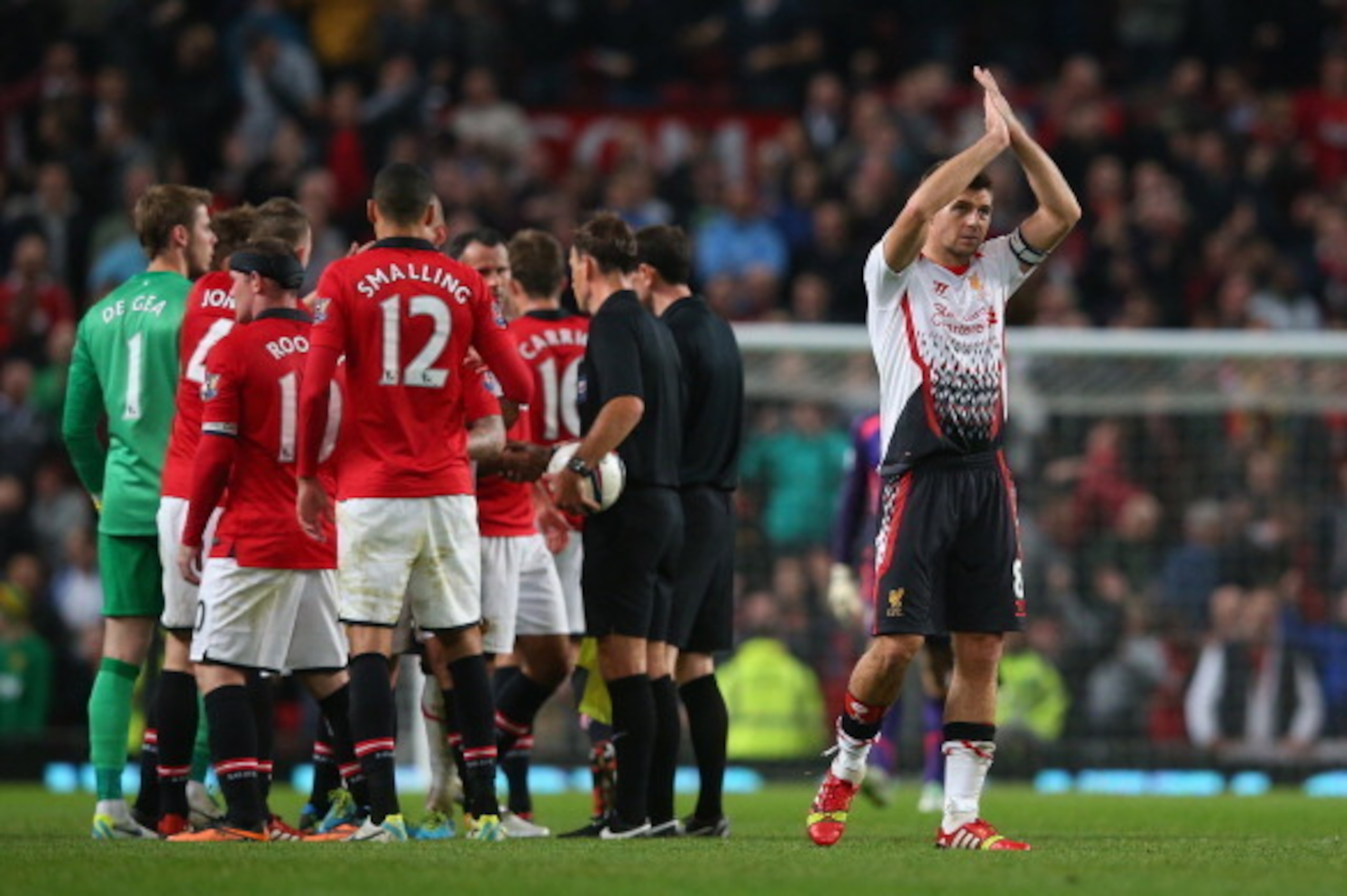 MANCHESTER, ENGLAND - SEPTEMBER 25:   Steven Gerrard of Liverpool applauds the fans at the end of the Capital One Cup Third Round match betwen Manchester United and Liverpool at Old Trafford on September 25, 2013 in Manchester, England.  (Photo by Julian 