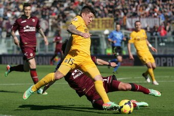 LIVORNO, ITALY - FEBRUARY 23: Juan Iturbe of Hellas Verona FC in action during the Serie A match between AS Livorno Calcio and Hellas Verona FC at Stadio Armando Picchi on February 23, 2014 in Livorno, Italy.  (Photo by Gabriele Maltinti/Getty Images)