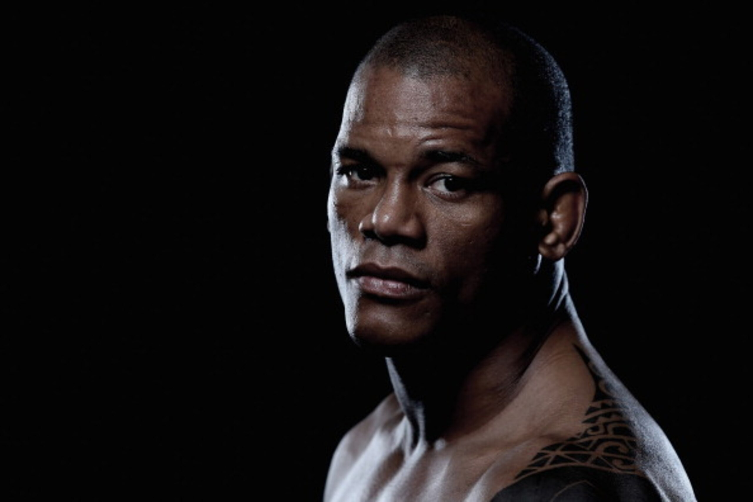 BRISBANE, AUSTRALIA - DECEMBER 06:  (EDITORS NOTE: Image has been desaturated) Hector Lombard poses during a UFC portrait session on December 6, 2013 in Brisbane, Australia.  (Photo by Chris Hyde/Getty Images)