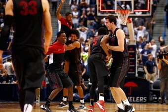 HARTFORD, CT - DECEMBER 18: Stefan Nastic #4 and Chasson Randle #5 of the Stanford Cardinal celebrate their 53-51 win against the Connecticut Huskies during the game at XL Center on December 18, 2013 in Hartford, Connecticut.  (Photo by Jared Wickerham/Ge