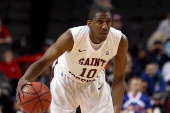 NEW YORK, NY - MARCH 14: Langston Galloway #10 of the Saint Joseph's Hawks runs down the clock late in the second half against the Dayton Flyers during the Quarterfinals of the 2014 Atlantic 10 Men's Basketball Tournament at Barclays Center on March 14, 2