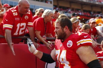 KANSAS CITY, MO - SEPTEMBER 15: Geoff Schwartz #74 of the Kansas City Chiefs greets fans after the victory over the Dallas Cowboys September 15, 2013 at Arrowhead Stadium in Kansas City, Missouri. (Photo by Kyle Rivas/Getty Images)