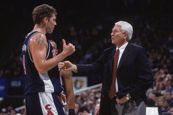 14 Feb 2002:  Head coach Lute Olson of Arizona Wildcats talks to his forward Luke Walton #4 during the Pac-10 game against the UCLA Bruins at the Pauley Pavilion in Westwood, California. The Bruins defeated the Wildcats 77-76.  \ Mandatory Credit:  Jeff G