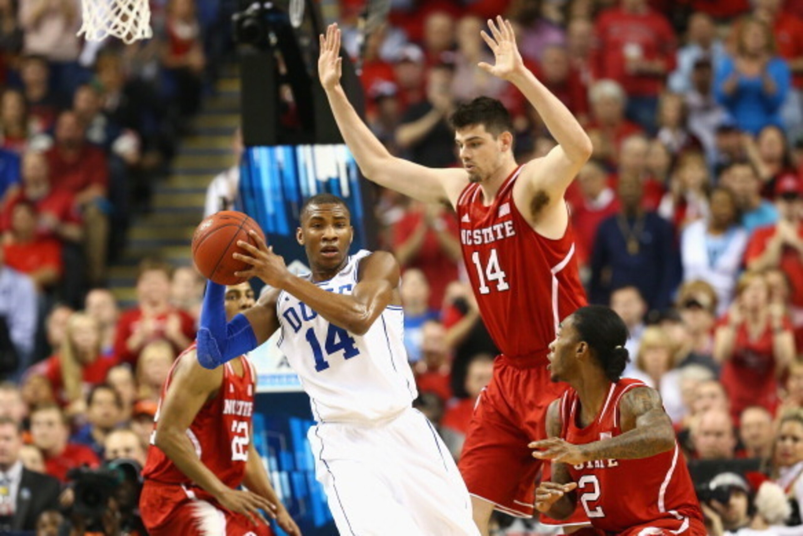 GREENSBORO, NC - MARCH 15:  Jordan Vandenberg #14 and teammate Anthony Barber #2 of the North Carolina State Wolfpack try to stop Rasheed Sulaimon #14 of the Duke Blue Devils during the semifinals of the 2014 Men's ACC Basketball Tournament at Greensboro 