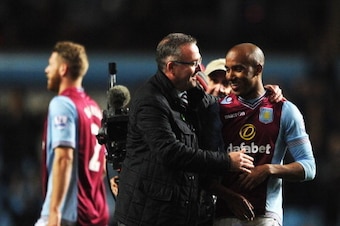 BIRMINGHAM, ENGLAND - MARCH 15:  Paul Lambert manager of Aston Villa congratulates goal scorer Fabian Delph of Aston Villa after the Barclays Premier League match between Aston Villa and Chelsea at Villa Park on March 15, 2014 in Birmingham, England.  (Ph
