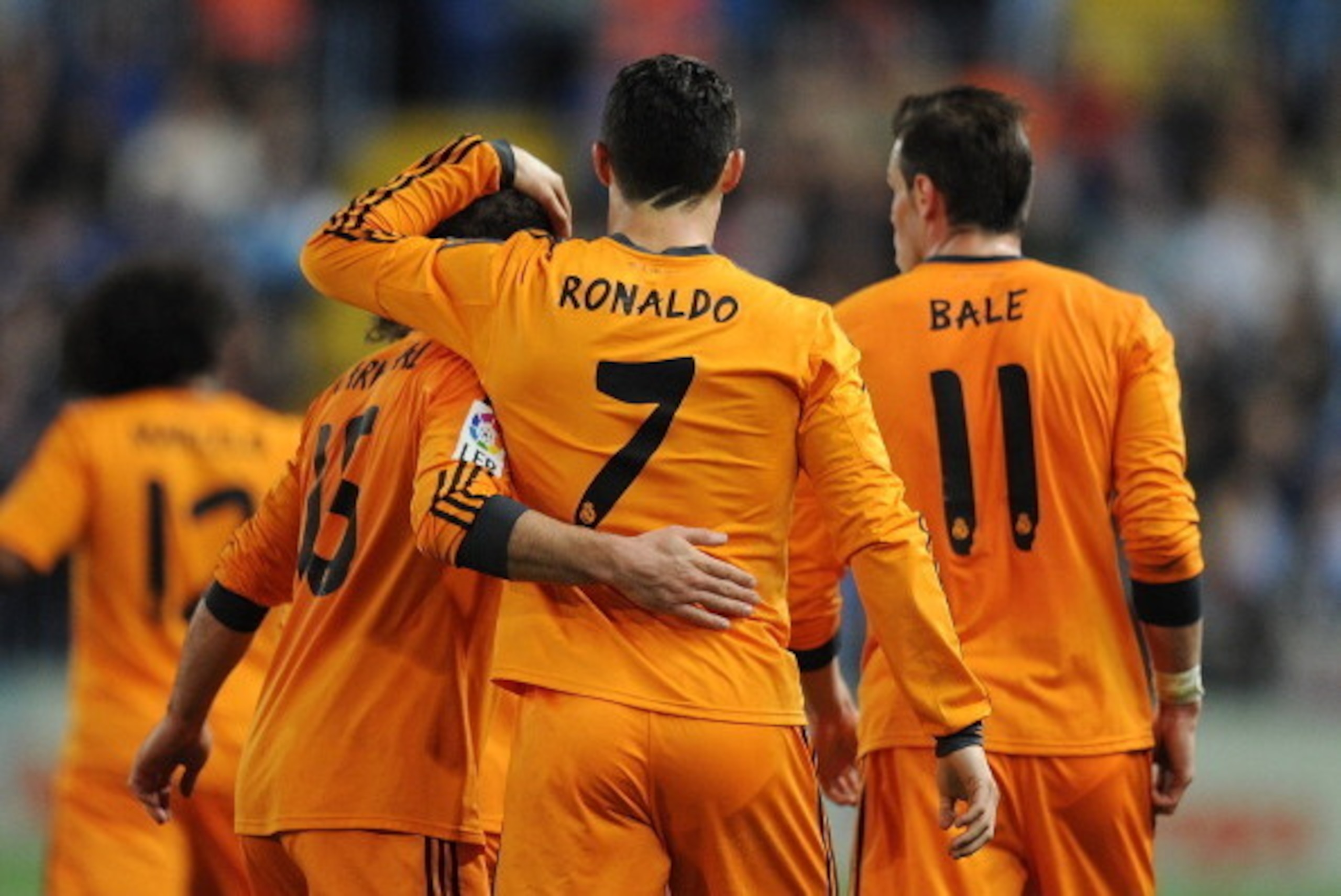 MALAGA, SPAIN - MARCH 15:  Cristiano Ronaldo of Real Madrid celebrates with Daniel Carvajal and Gareth Bale after scoring Real's opening goal during the La Liga match between Malaga and Real Madrid at La Rosaleda Stadium on March 15, 2014 in Malaga, Spain