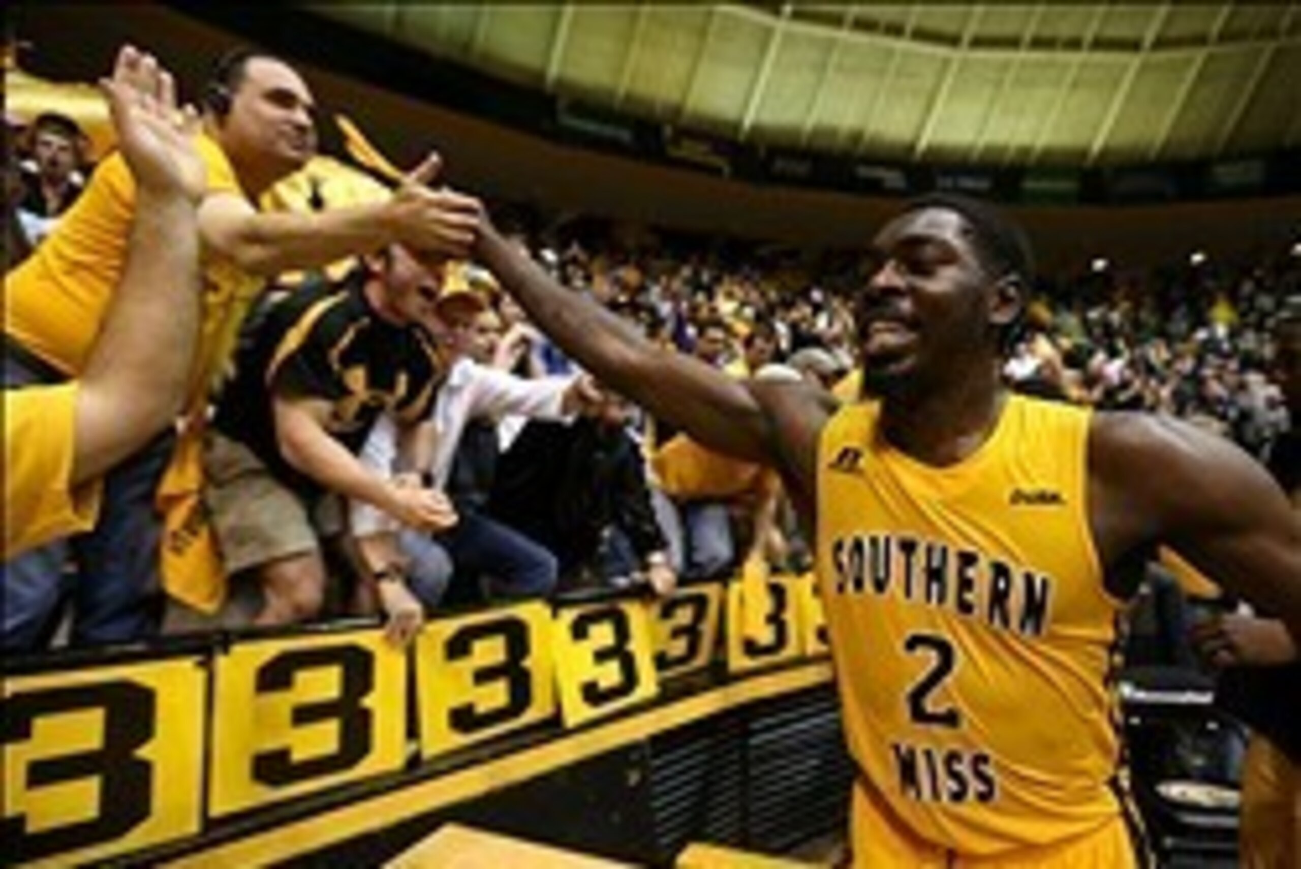 Feb 22, 2014; Hattiesburg, MS, USA; Southern Miss Golden Eagles guard/forward Matt Bingaya (2) celebrates with fans after a win against the UTEP Miners at Reed Green Coliseum. Southern Miss won, 77-68. Mandatory Credit: Chuck Cook-USA TODAY Sports