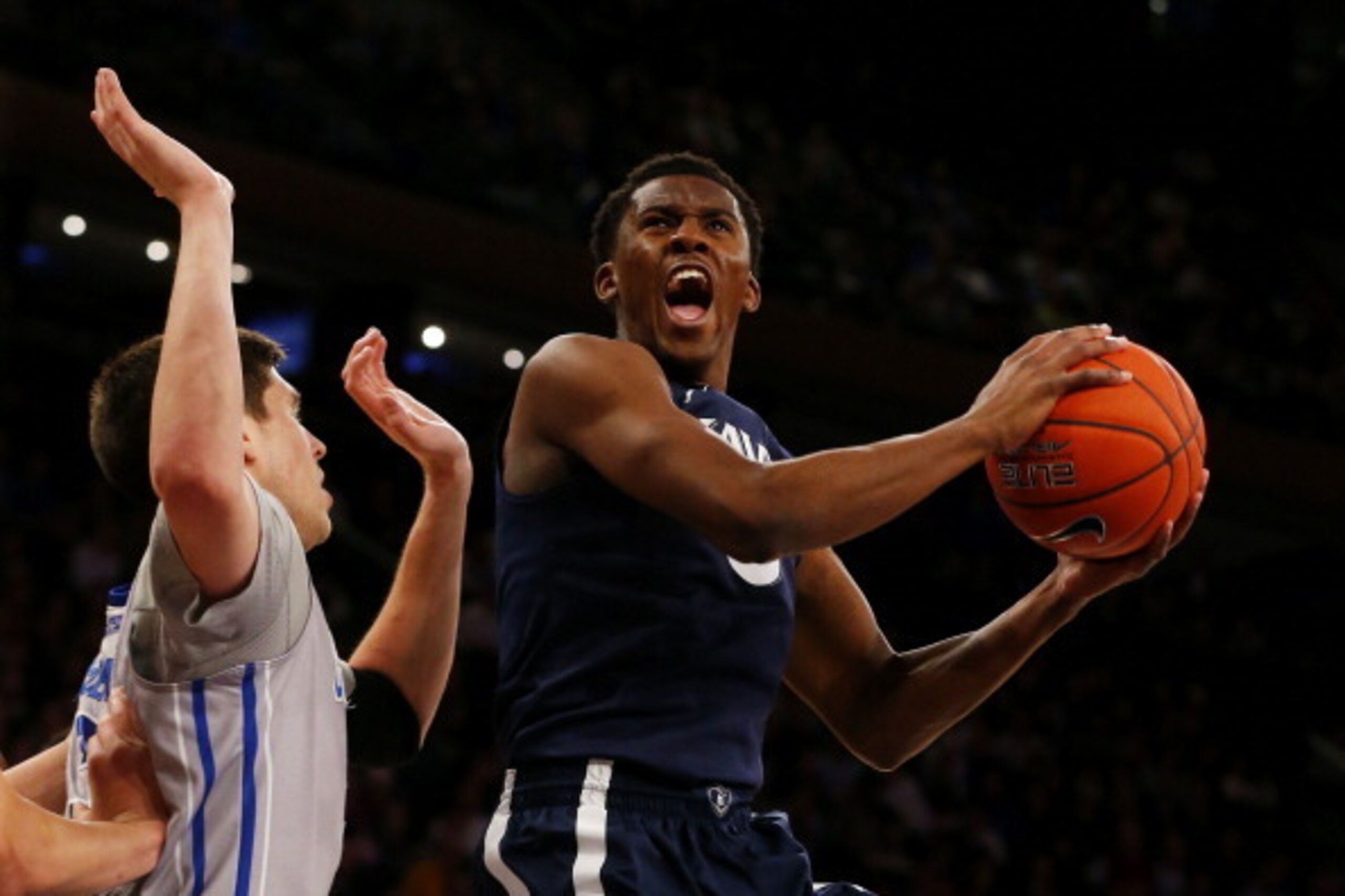 NEW YORK, NY - MARCH 14:  Semaj Christon #0 of the Xavier Musketeers shoots against Doug McDermott #3 of the Creighton Bluejays in the first half during the Semifinals of the 2014 Men's Big East Basketball Tournament at Madison Square Garden on March 14, 