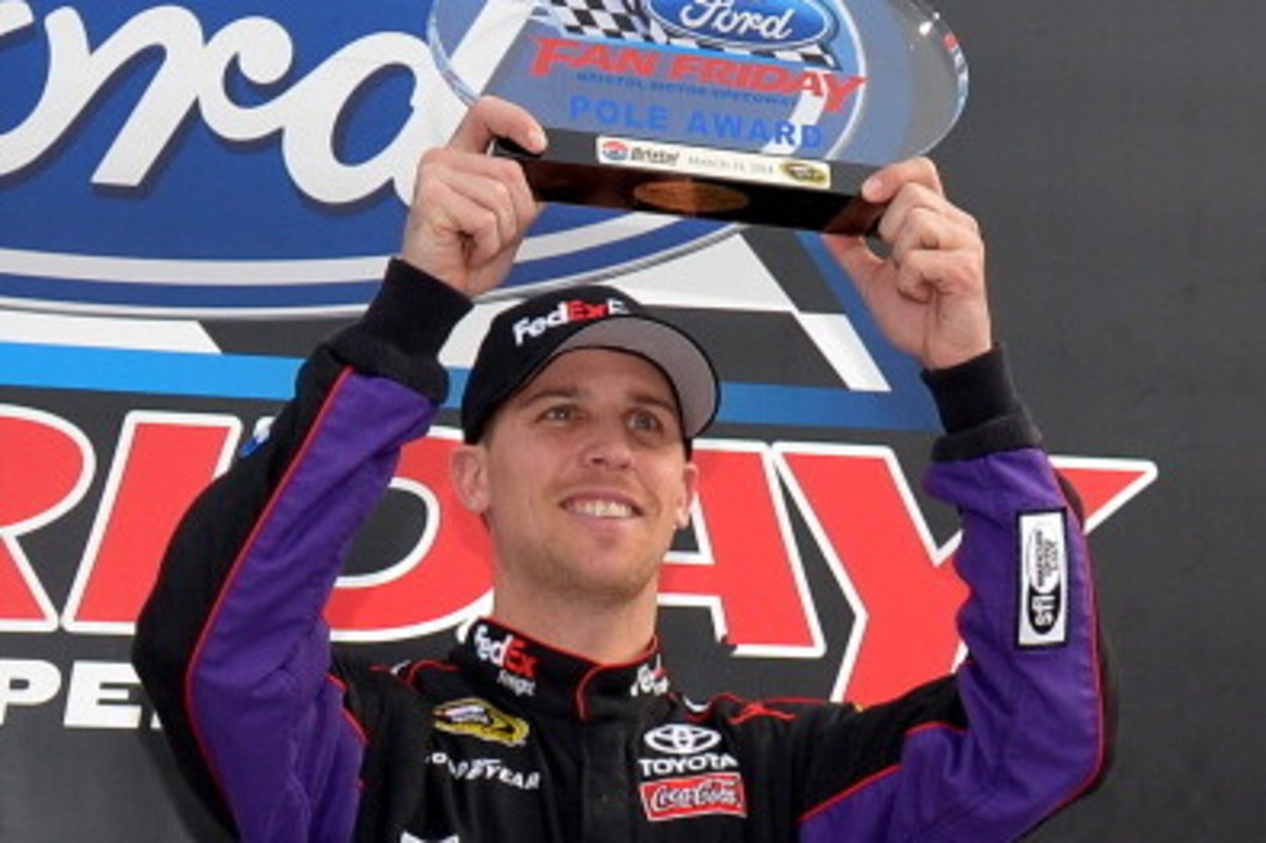 BRISTOL, TN - MARCH 14:  Denny Hamlin, driver of the #11 FedEx Freight Toyota, holds up the pole award after qualifying for the pole position for the NASCAR Sprint Cup Series Food City 500 at Bristol Motor Speedway on March 14, 2014 in Bristol, Tennessee.
