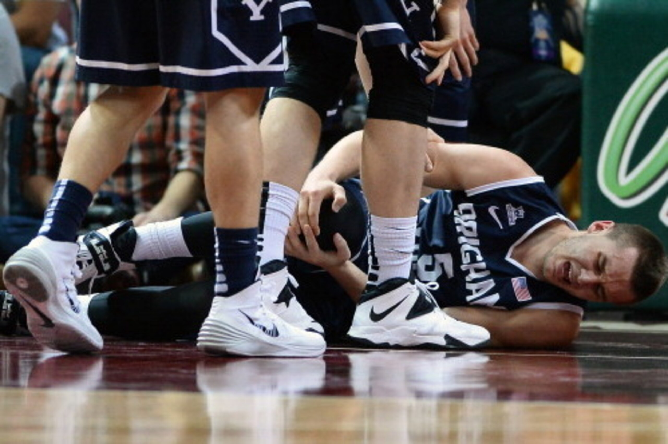 LAS VEGAS, NV - MARCH 11: Kyle Collinsworth #5 of the Brigham Young Cougars holds his knee after injuring it during the championship game of the West Coast Conference Basketball tournament against the Gonzaga Bulldogs at the Orleans Arena on March 11, 20 LAS VEGAS, NV - MARCH 11: Kyle Collinsworth #5 of the Brigham Young Cougars holds his knee after injuring it during the championship game of the West Coast Conference Basketball tournament against the Gonzaga Bulldogs at the Orleans Arena on March 11, 20