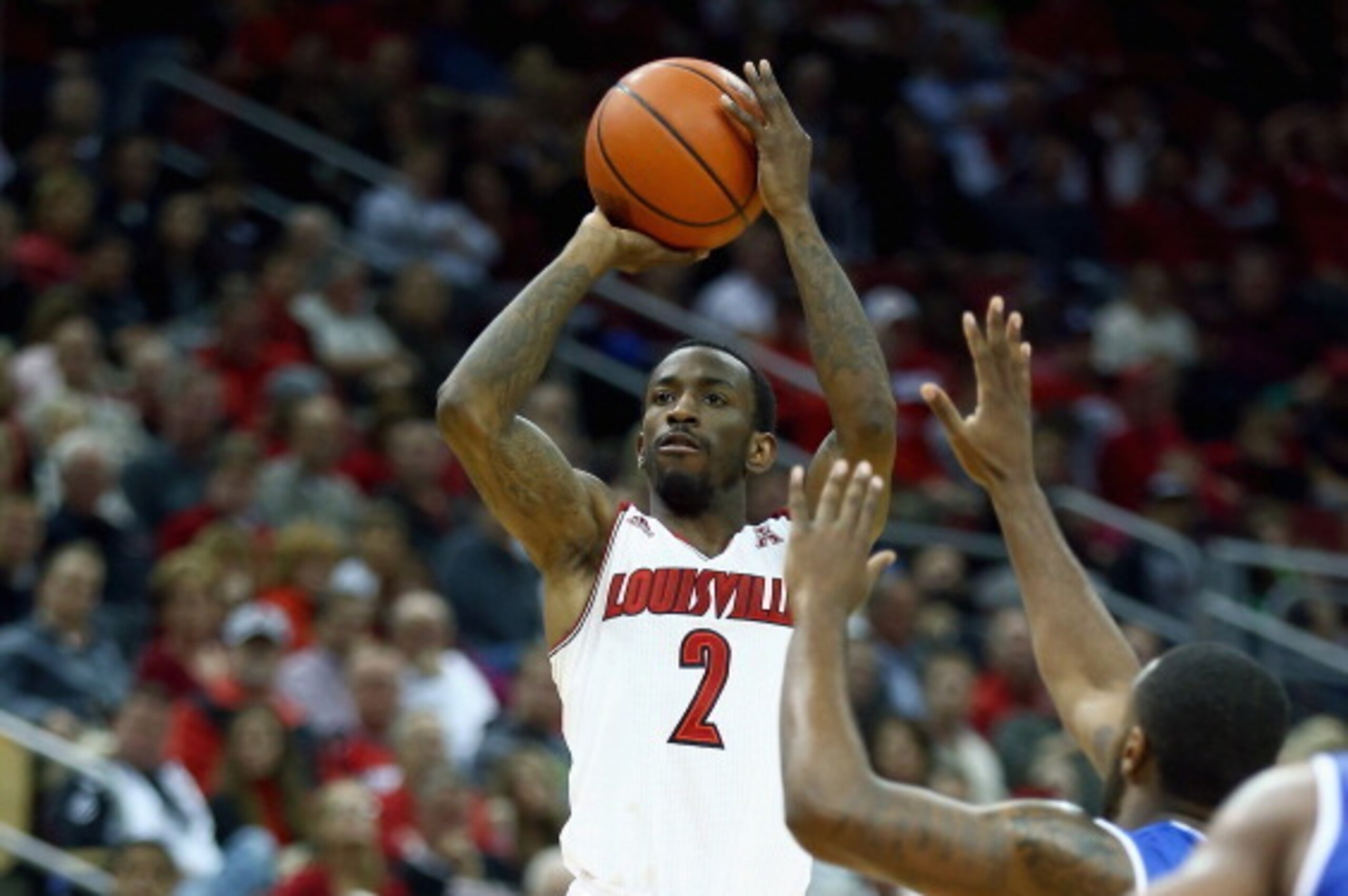 LOUISVILLE, KY - NOVEMBER 12:  Russ Smith # 2 of the Louisville Cardinals shoots the ball during the game against the Hofstra Pride at KFC YUM! Center on November 12, 2013 in Louisville, Kentucky.  (Photo by Andy Lyons/Getty Images)