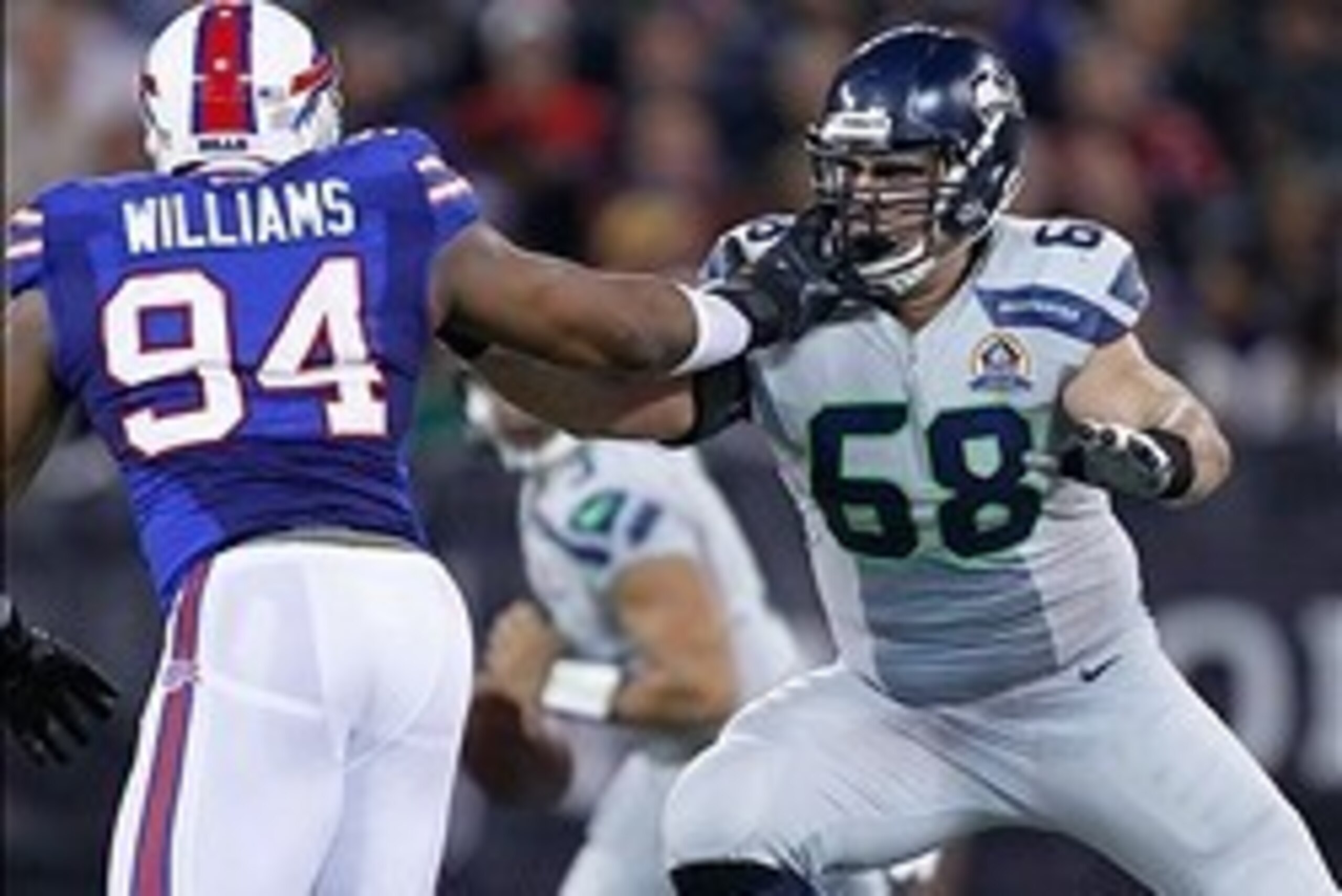 December 16, 2012; Toronto, ON, Canada; Buffalo Bills defensive end Mario Williams (94) against Seattle Seahawks offensive tackle Breno Giacomini (68) at the Rogers Centre. Seattle defeated Buffalo 50-17. Mandatory Credit: John E. Sokolowski-USA TODAY Spo